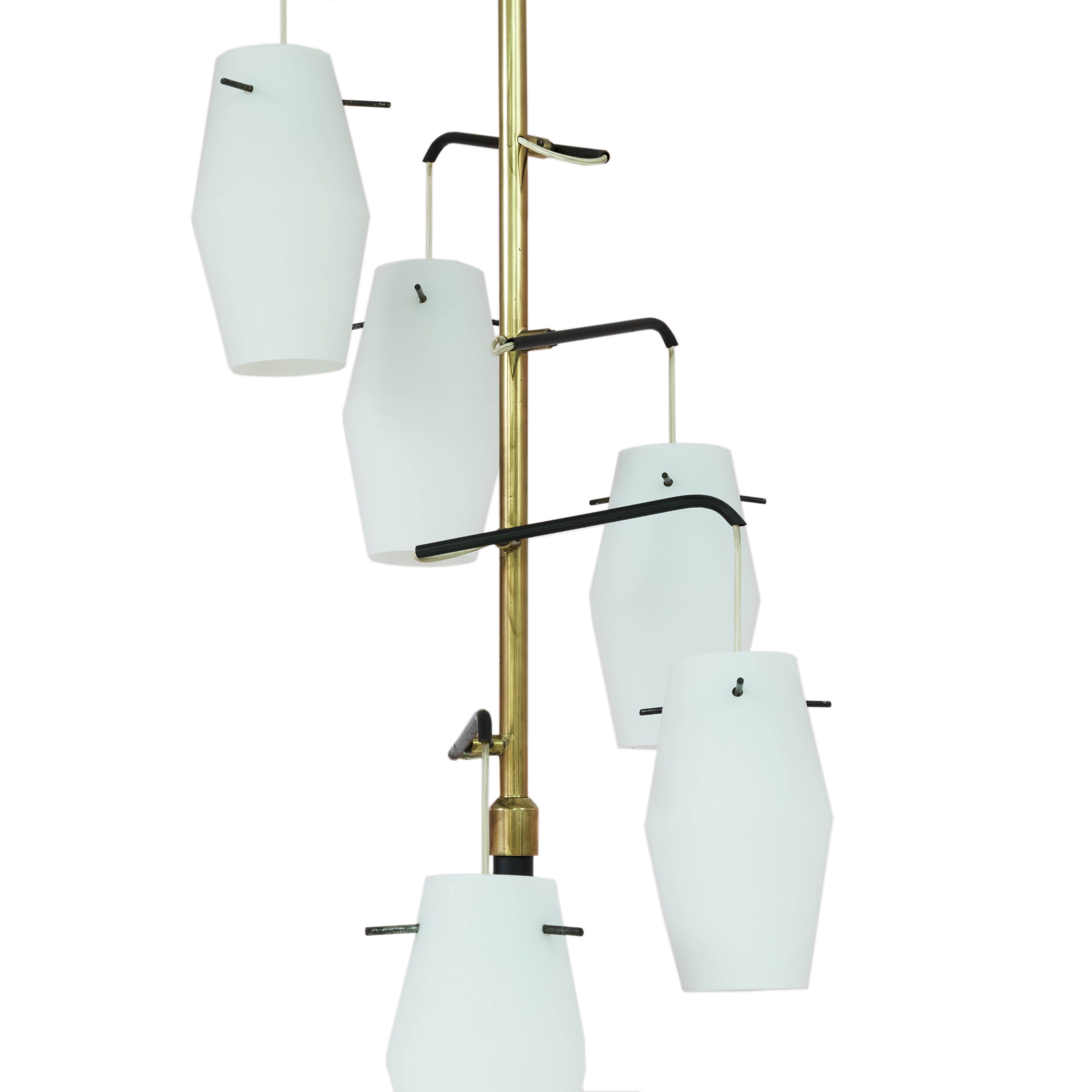 Italian floor lamp manufactured in the mid-1950s by Chiarini, brass structure and white opaline glass shades.