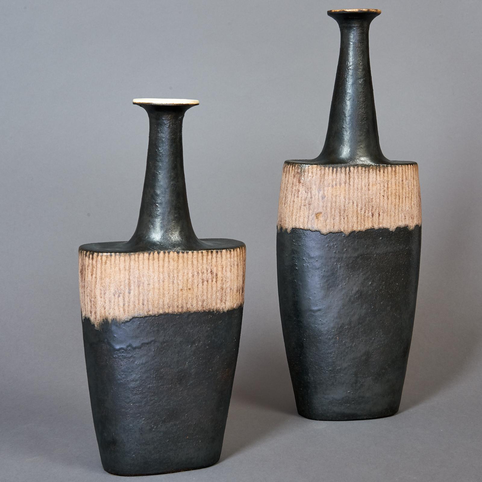 Bruno Gambone ( b.1936)
Exquisite pair of shaped and incised long neck vessels, black glazed ceramic with contrasting beige linear decor.
Italy, circa 1980, Signed at base
Dimensions: 18 H x 7 W, 14 H x 7 W.



 