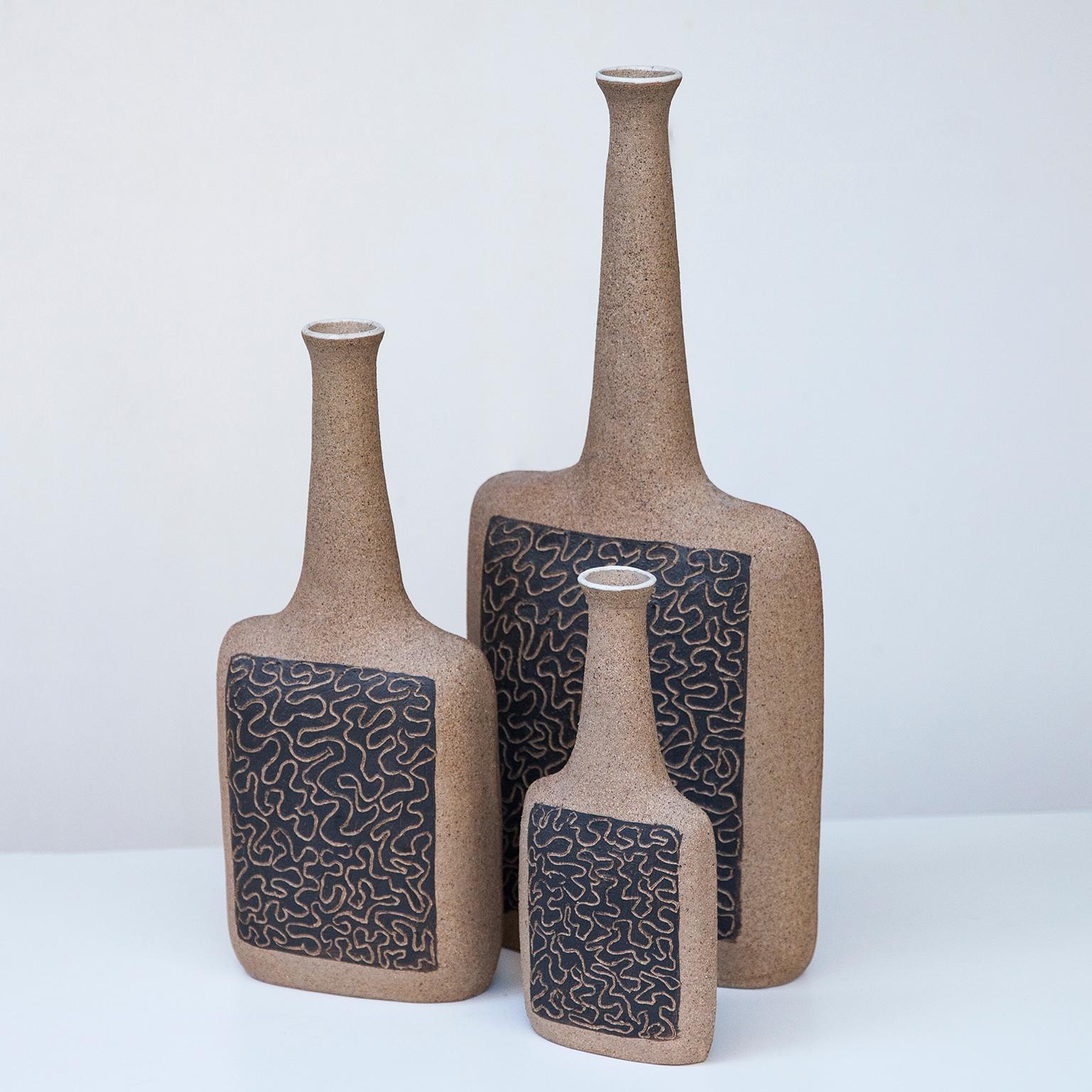 Bruno Gambone set of three stoneware vases in raw finish, Italy 1980s, signed Gambone, Italy.
The price is for the set of the 3 vases.

46 H x 20 B x 8 D cm other heights 34,5 and 24 cm.