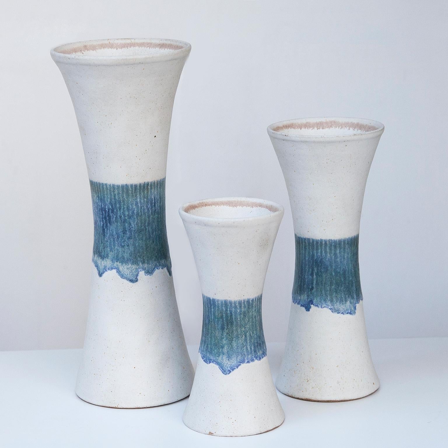 Bruno Gambone set of three vase in white and blue stoneware Italy 1970s, signed Gambone, Italy.

40 H x 16 D, 31 H x 13 D, 24 H x 11 D cm.