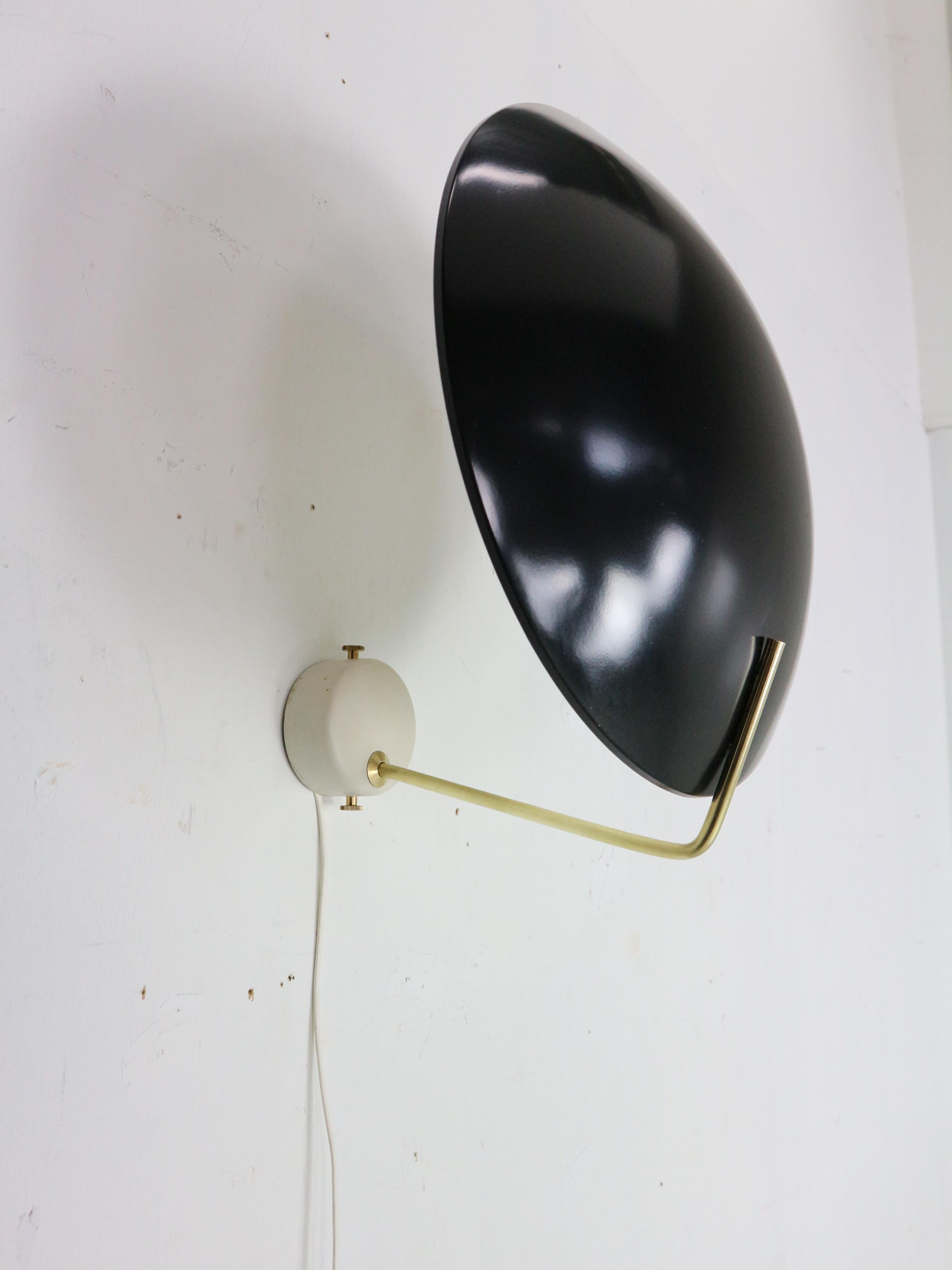 Elegant wall light designed by Bruno Gatta and manufactured for Stilnovo in 1960's Italy.
Model - 232.
Tested- working.

This table light features a black lacquered aluminium shade with a brass rod on a white carrara marble base.

We choose