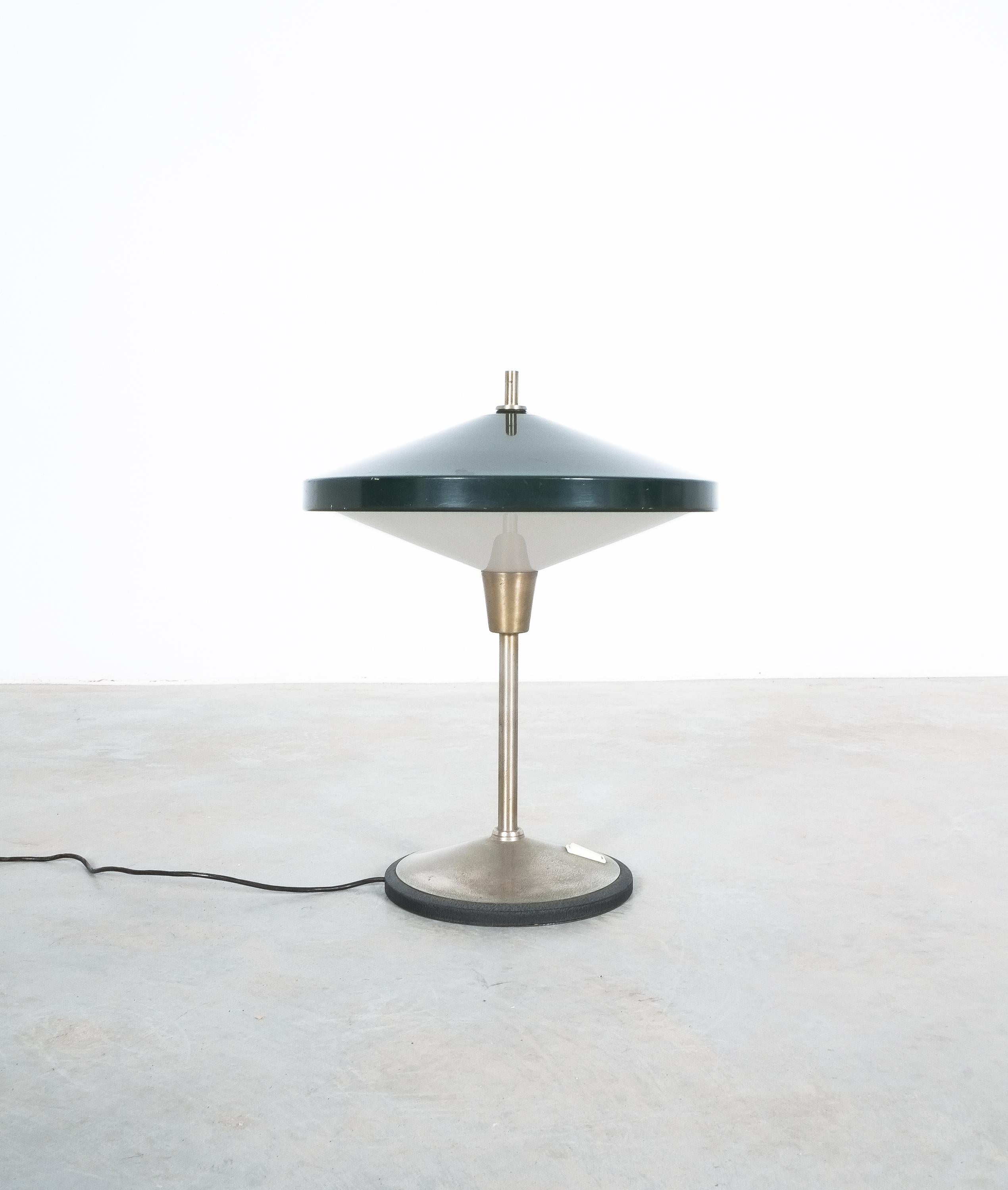 Dark green desk light by Bruno Gatta, Italy, circa 1955.

Elegant lamp made from lacquered aluminum, nickeled brass and Perspex (Lucite) and a cast iron foot. We have cleaned it but left most of the patina intact. Good original vintage condition