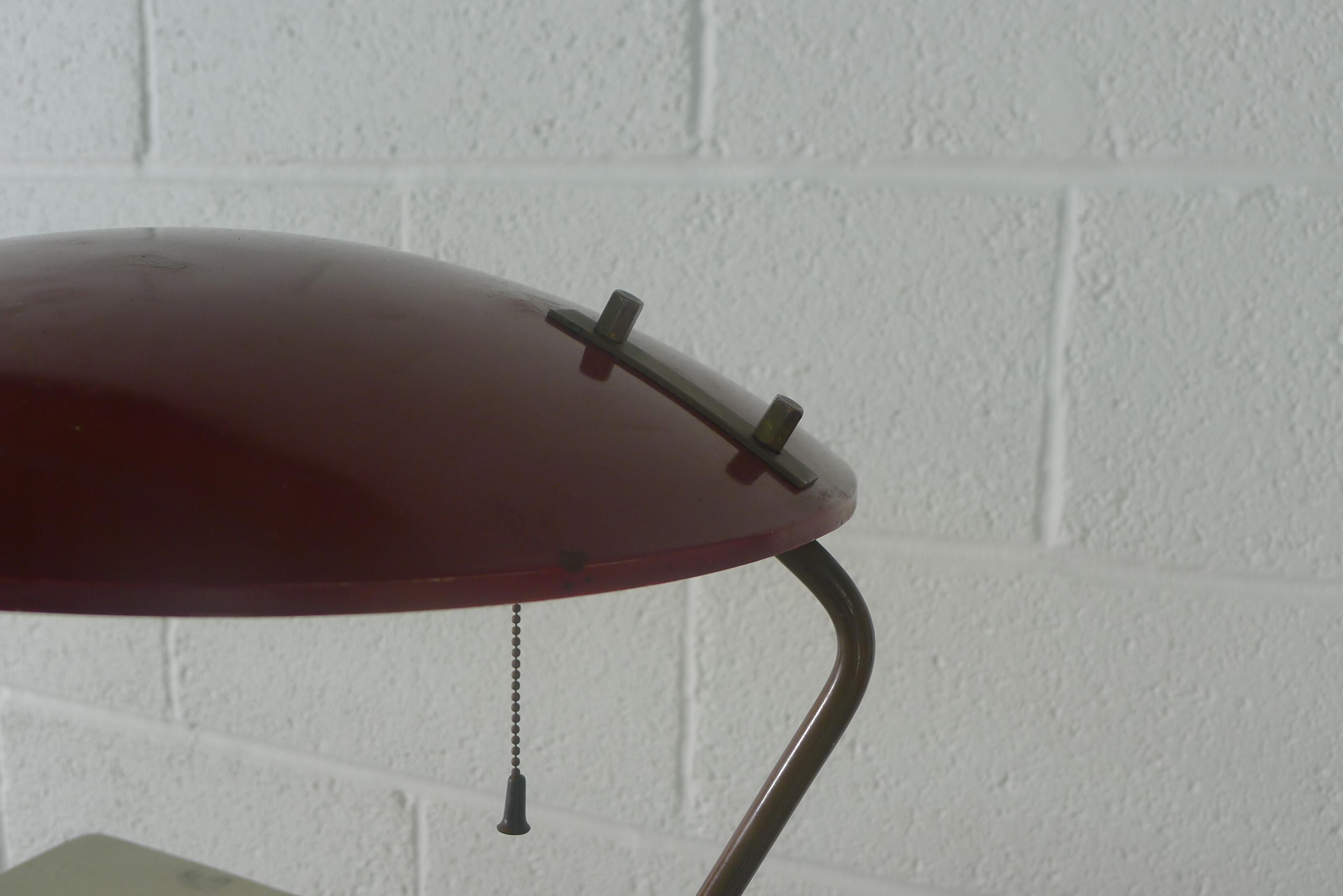 Bruno Gatta, table or desk lamp for Stilnovo of Italy, 1950s. Heavy marble base, brass stem holding enameled metal shade in maroon. 
Original manufacturers label to underside of shade . 

Some slight distortion to shade.