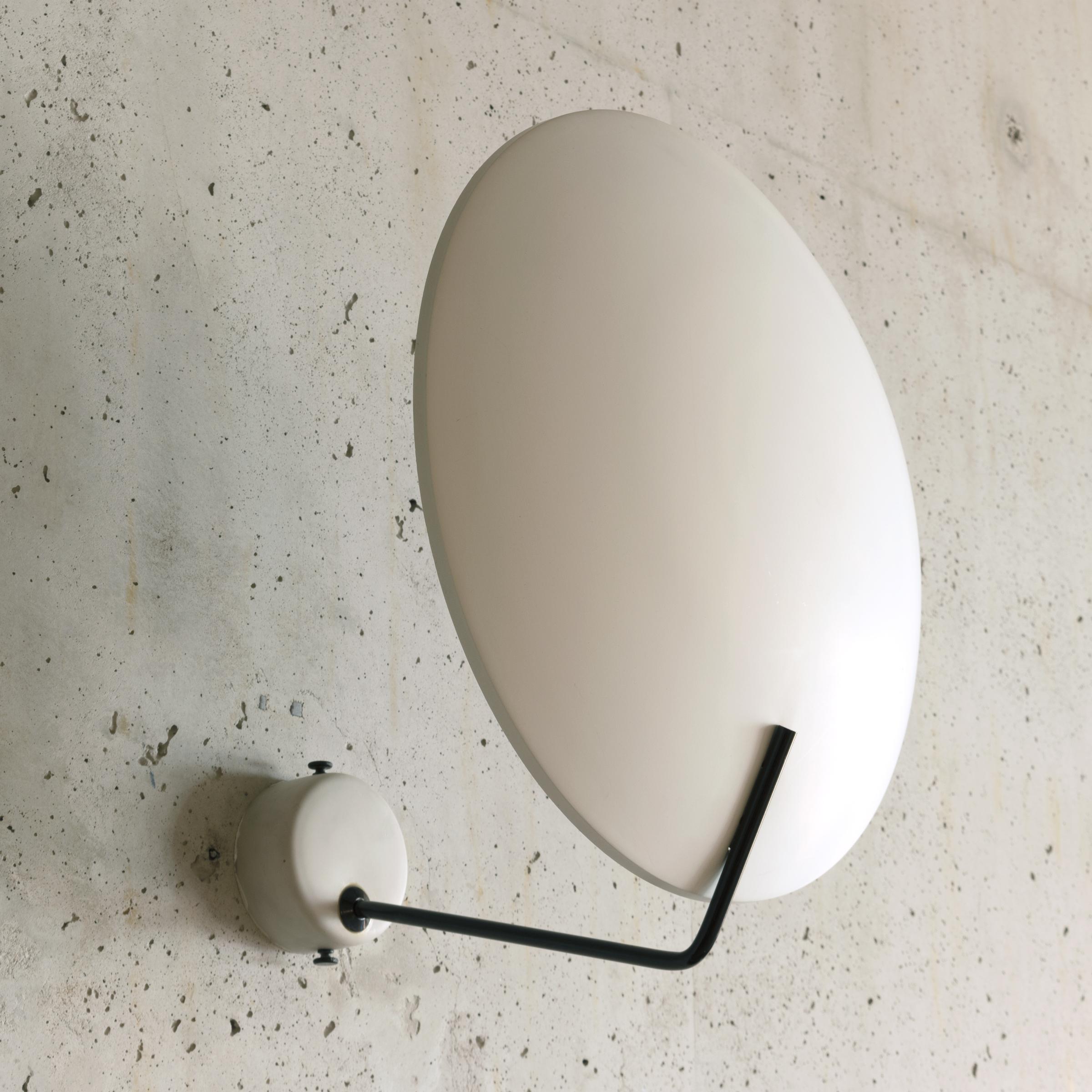 Bruno Gatta wall or ceiling lamp Model 232 designed in 1962 for Stilnovo Italy. White metal shade hold by thin black wire and white circular bracket all in very good original condition. Bought from the first owners with a residence full of