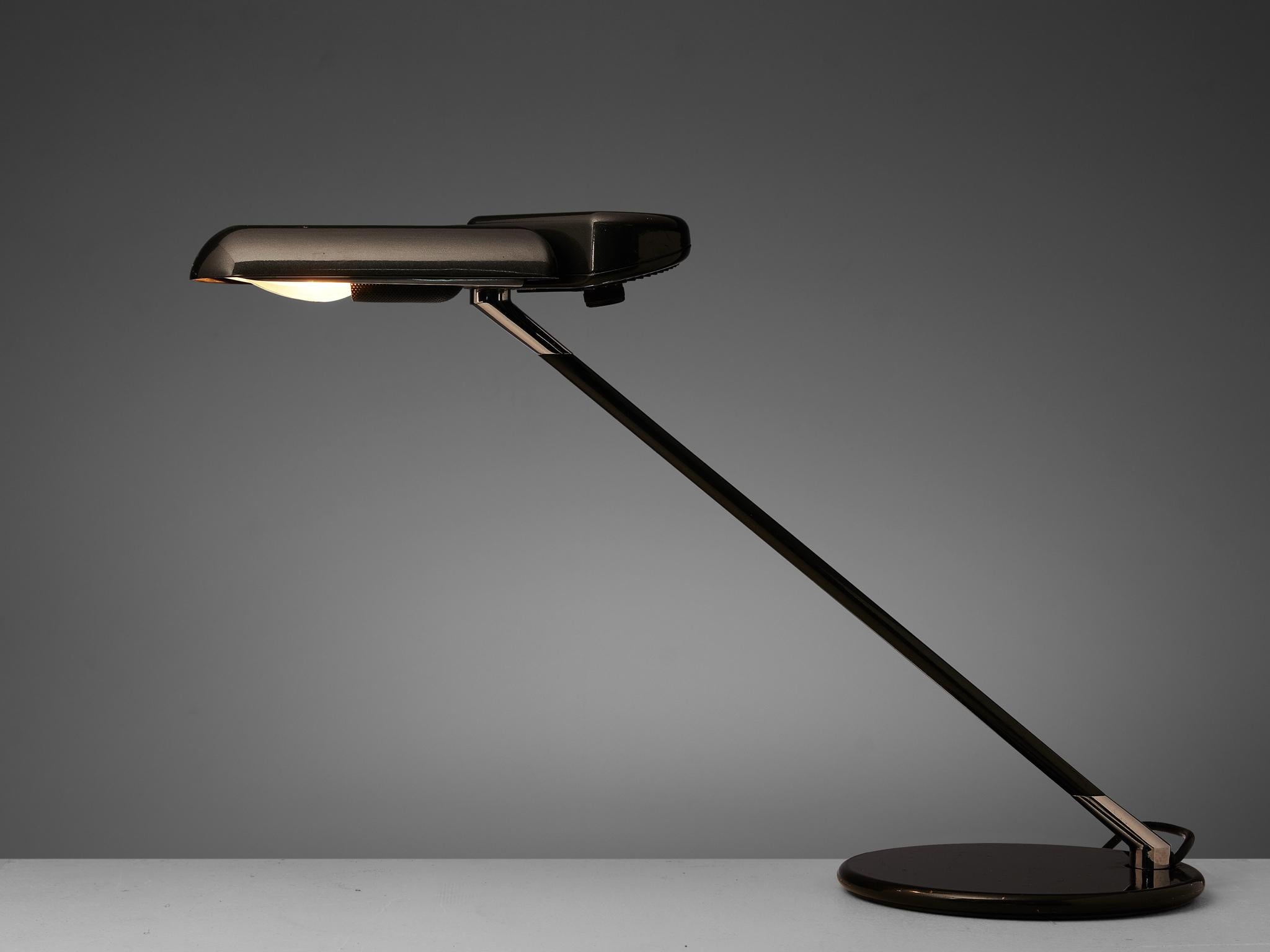 Bruno Gecchelin for Arteluce, desk lamp ‘Ring’ A400, black metal, Italy, 1979

This ‘Ring’ desk lamp by Bruno Gecchelin for Arteluce was designed in 1979. It features an adjustable shade that can be turned in any direction that you prefer. The