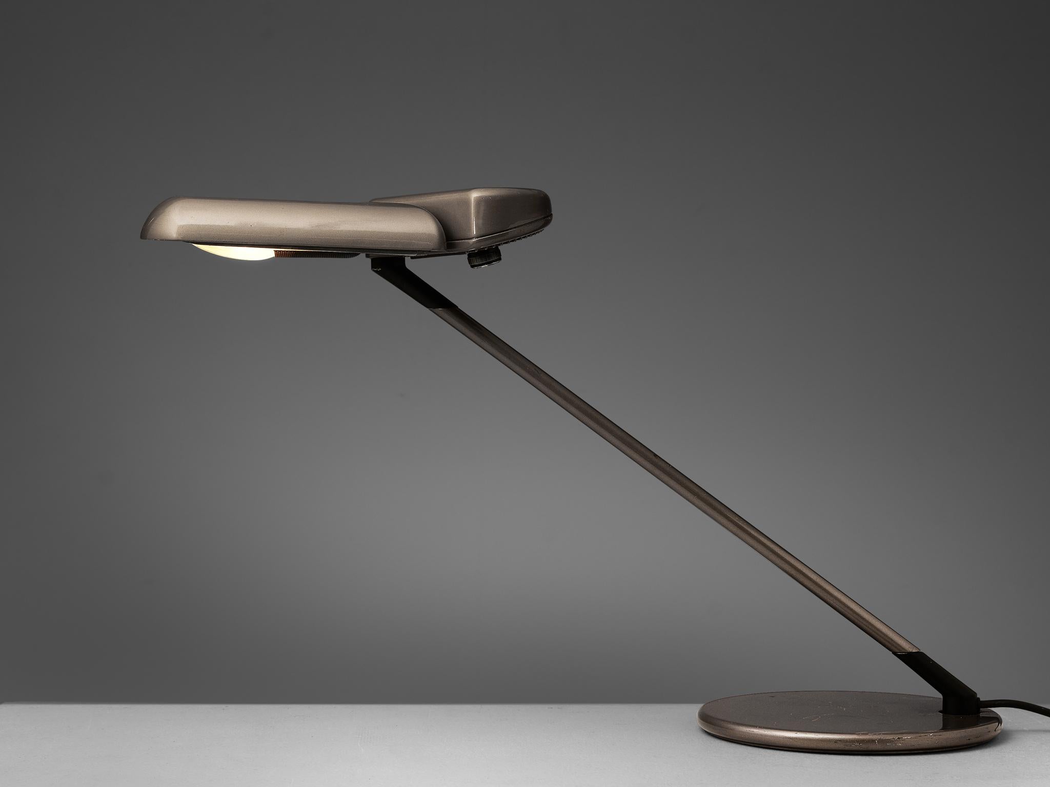 Bruno Gecchelin for Arteluce, desk lamp ‘Ring’ A400, metal, Italy, 1979

This ‘Ring’ desk lamp by Bruno Gecchelin for Arteluce was designed in 1979. It features an adjustable shade that can be turned in any direction that you prefer. The switch is