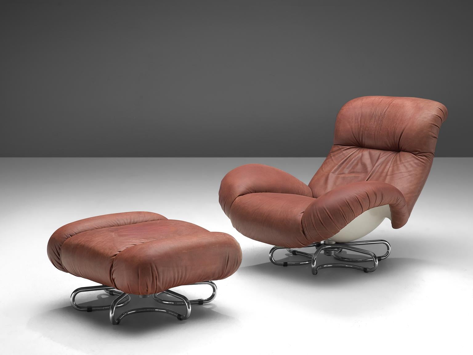 Bruno Gecchelin for Busnelli lounge chair and ottoman in leather, fiberglass and chromed metal, Italy, 1972.

This great, rare lounge chair with matching ottoman designed in 1972 by Bruno Gecchelin for Busnelli, comes in its original red leather