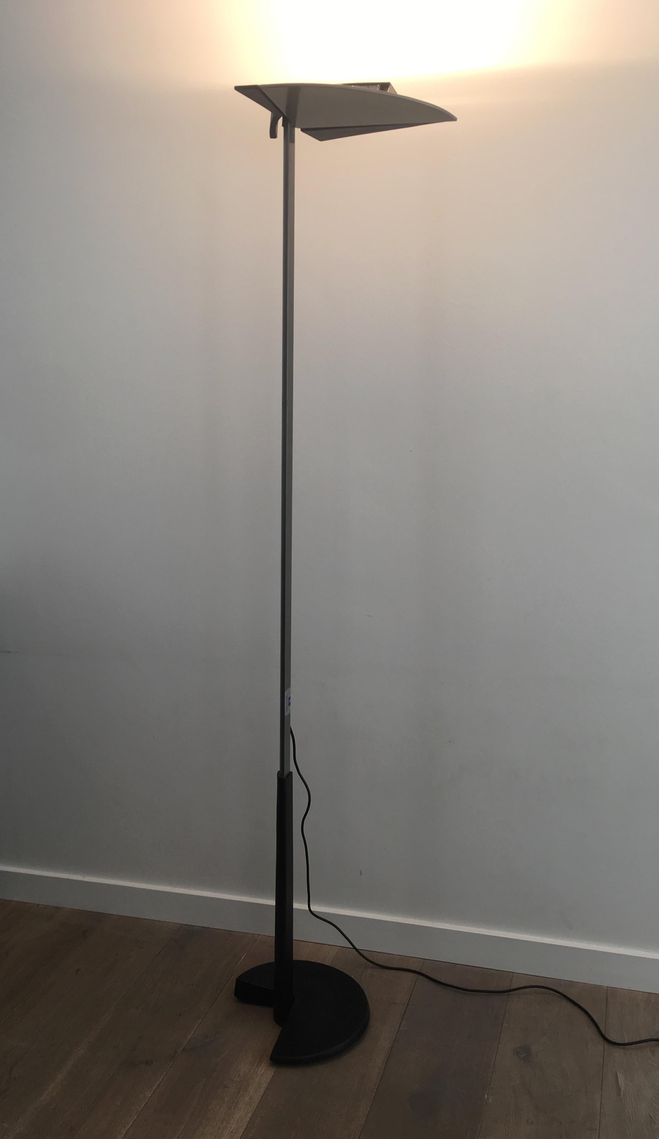 This floor lamp is made of grey enamel with mat black rubber details. This light was made by Bruno Gecchelin for Gruppo Skipper and is signed 