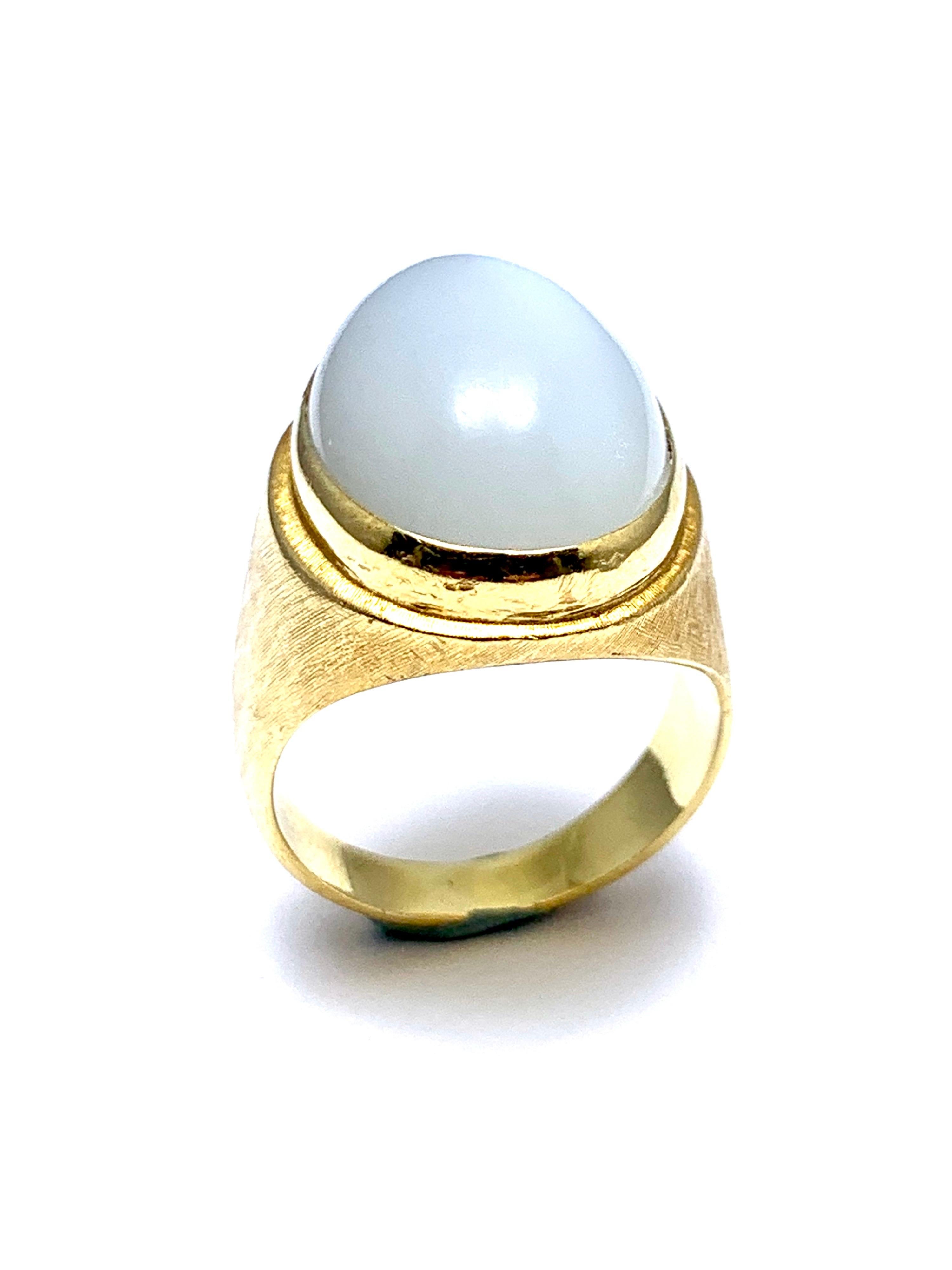 A beautiful Moonstone fashion ring designed by Bruno Guidi. The 11.88 cabochon Moonstone displays a lustrous adularescence, bezel set in an 18 karat yellow gold simple design ring. The inside shank is signed 