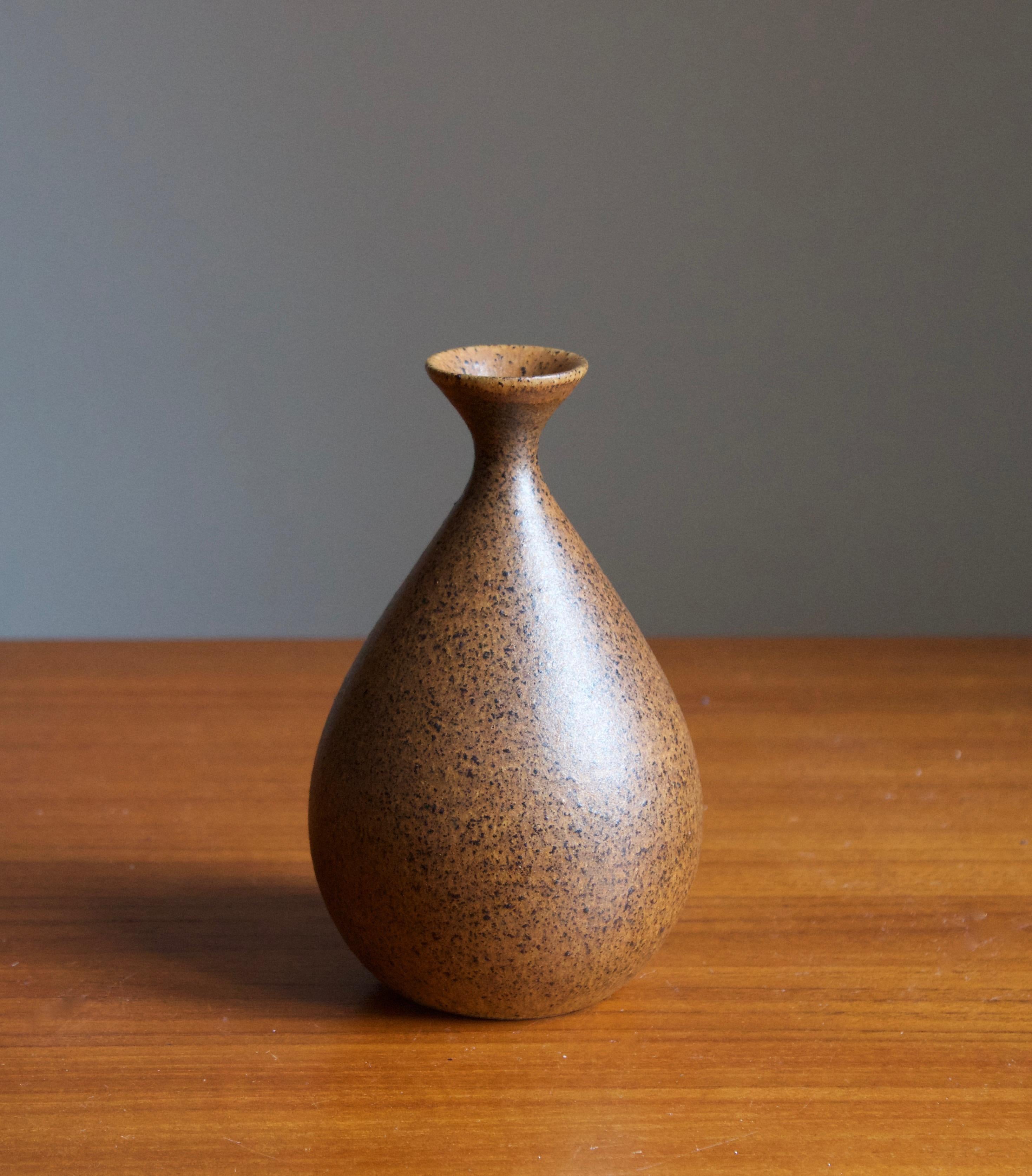 A small handmade stoneware vase, executed by Bruno Karlsson in abstract form and highly artistic brown glaze. In his Studio, called 
