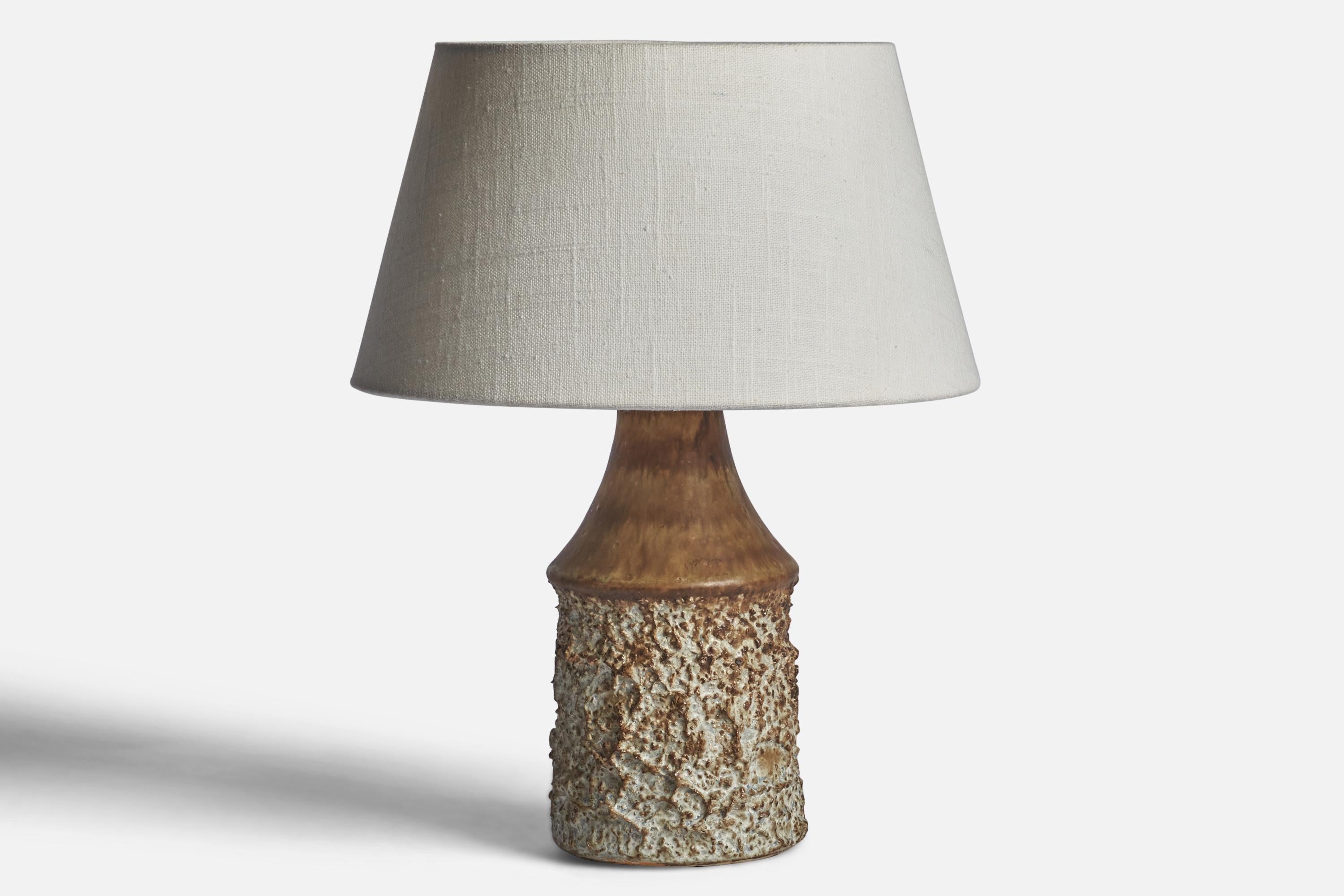 A brown and grey-glazed stoneware table lamp designed by Bruno Karlsson and produced by Ego Stengods, Sweden, 1960s.

Dimensions of Lamp (inches): 9.65” H x 4.25” Diameter
Dimensions of Shade (inches): 7” Top Diameter x 10” Bottom Diameter x