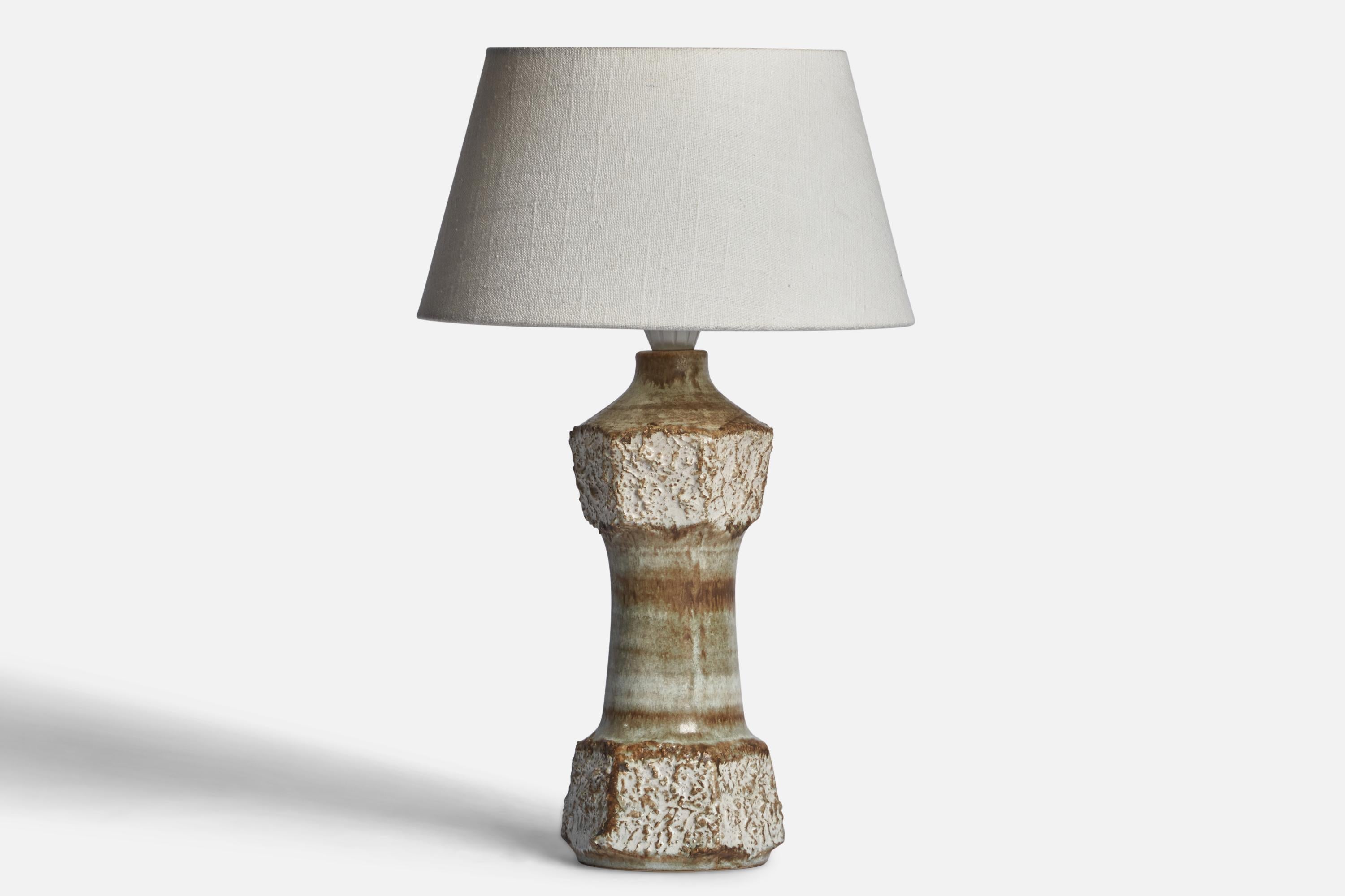 A grey-glazed stoneware table lamp designed by Bruno Karlsson and produced by Ego Stengods, Sweden, c. 1960s.

Dimensions of Lamp (inches): 13.15” H x 4.75” Diameter
Dimensions of Shade (inches): 7” Top Diameter x 10” Bottom Diameter x