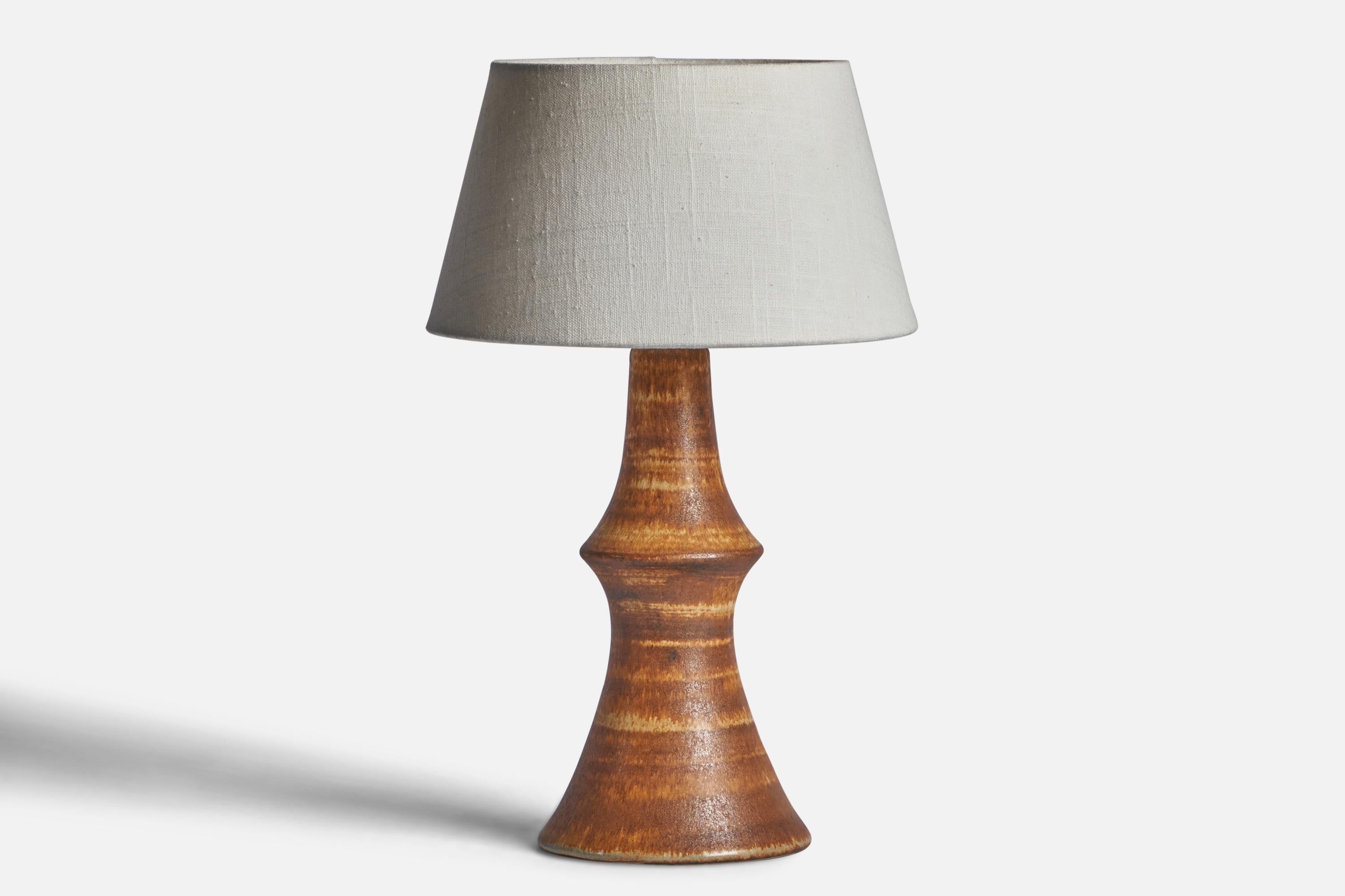 
A brown-glazed stoneware table lamp designed by Bruno Karlsson and produced by Ego Stengods, Sweden, 1960s.
Dimensions of Lamp (inches): 12.75” H x 5.65” Diameter
Dimensions of Shade (inches): 7” Top Diameter x 10” Bottom Diameter x 5.5” H