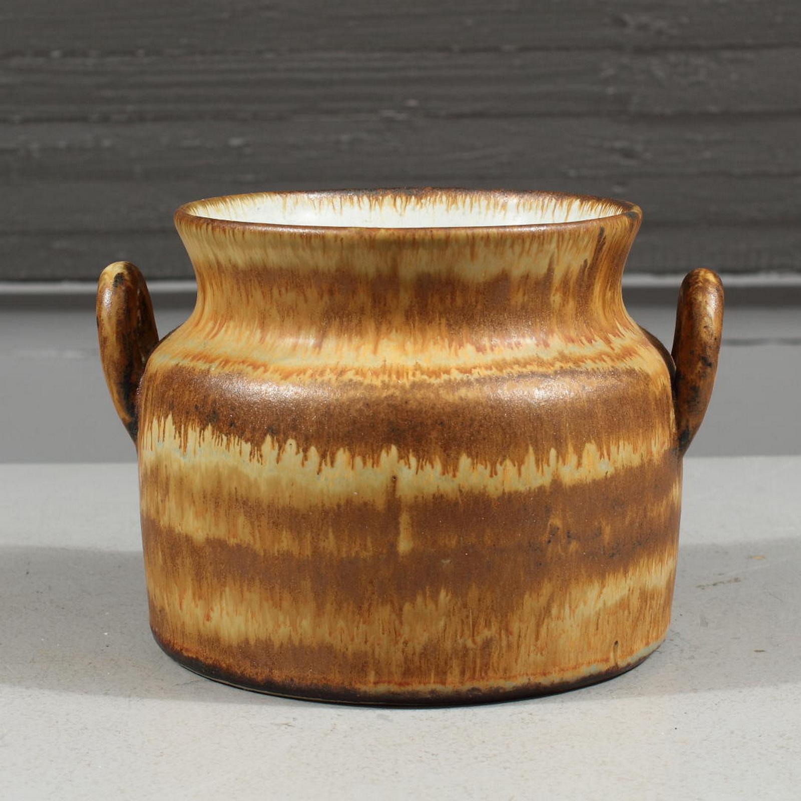 A stoneware vase, executed by Bruno Karlsson in abstract form and highly artistic brown glaze. 
Made in his studio, called 