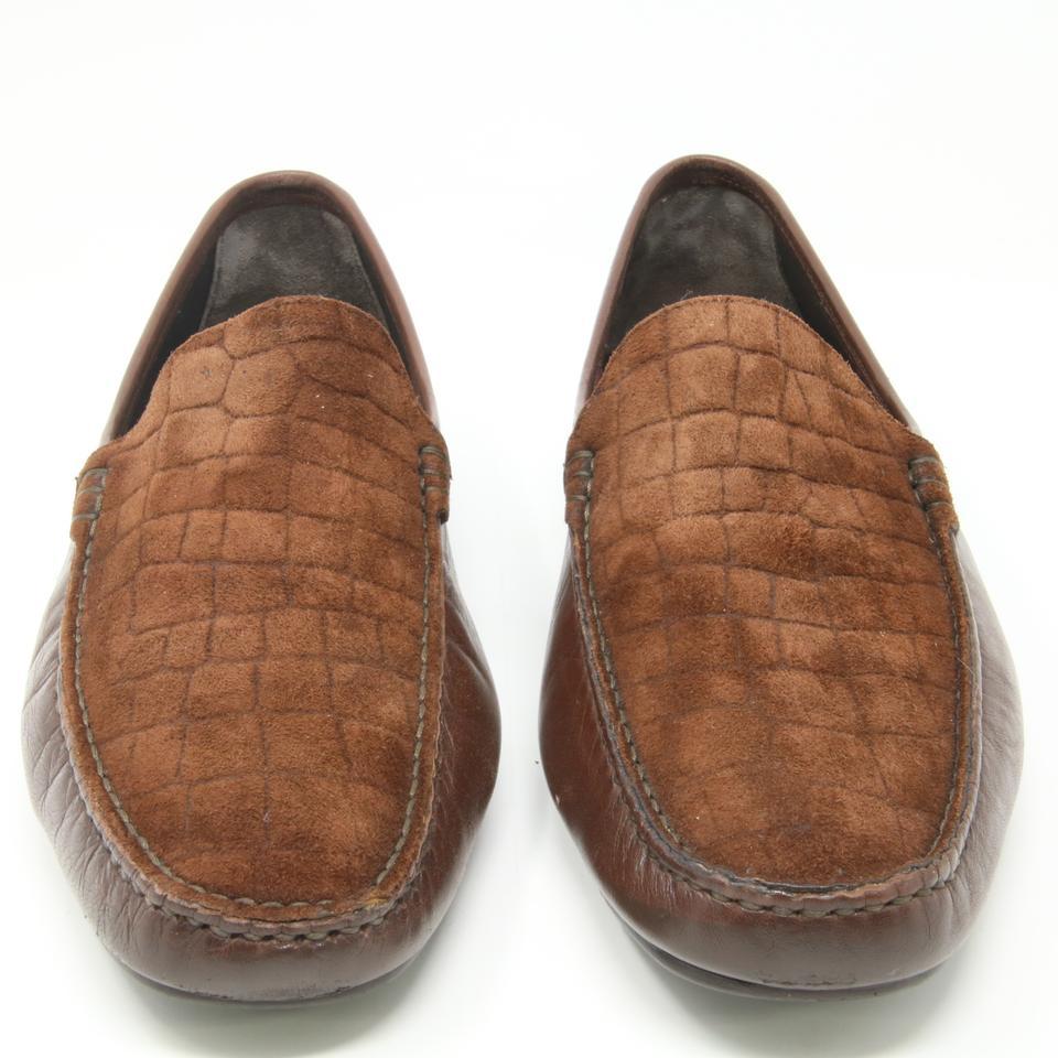 Bruno Magli Brown Signature Croc Embossed Moccasins Loafers Slip on Dress Formal Shoes

Bruno Magli's croc embossed loafer features hand-stitched suede leather uppers and an exceptionally supple padded rubber sole. Moccasin construction for