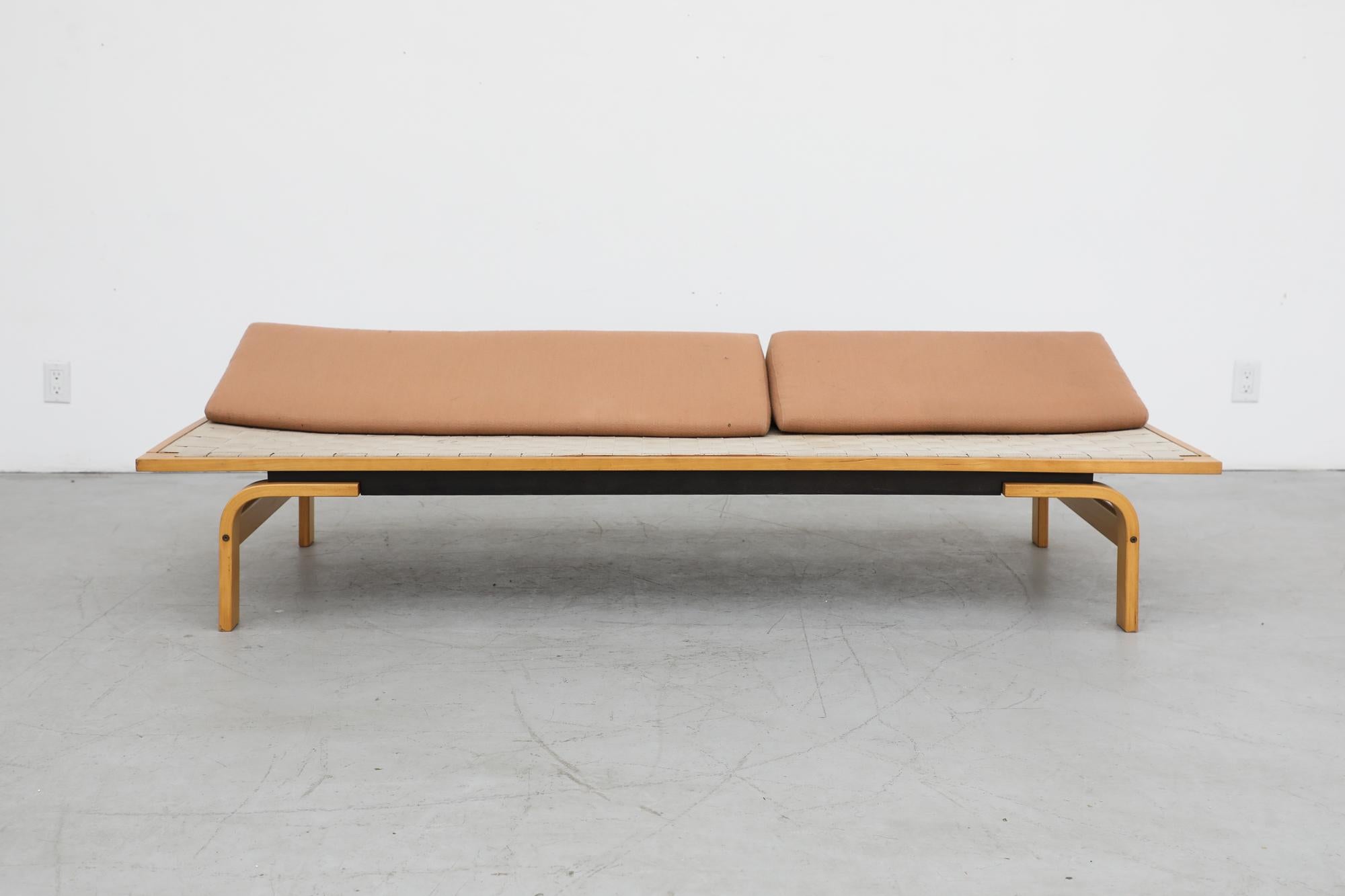 Alvar Aalto Style Daybed with bent wooden legs and original woven strapping and pink wool upholstered triangle cushions. Others have been seen with a thin mattress pad. Visible wear and staining to webbing. Birch Bentwood frame and original webbing.
