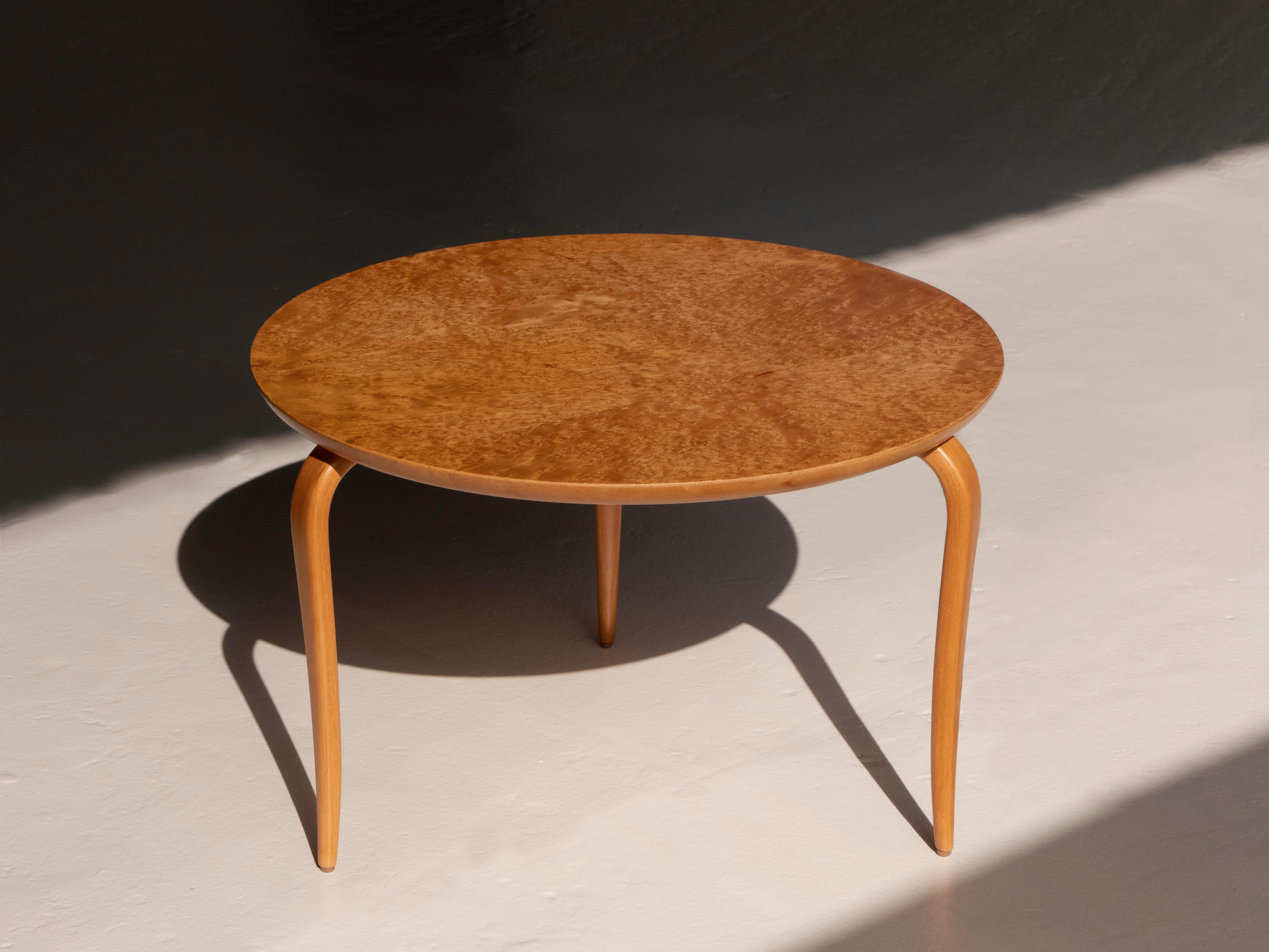 Bruno Mathsson 'Annika' cockail table / side table. It features solid birch wood tapered legs and a burlwood top. The table was manufactured by Dux, Sweden circa 1960's. The table is in excellent condition and has been refinished. It has the