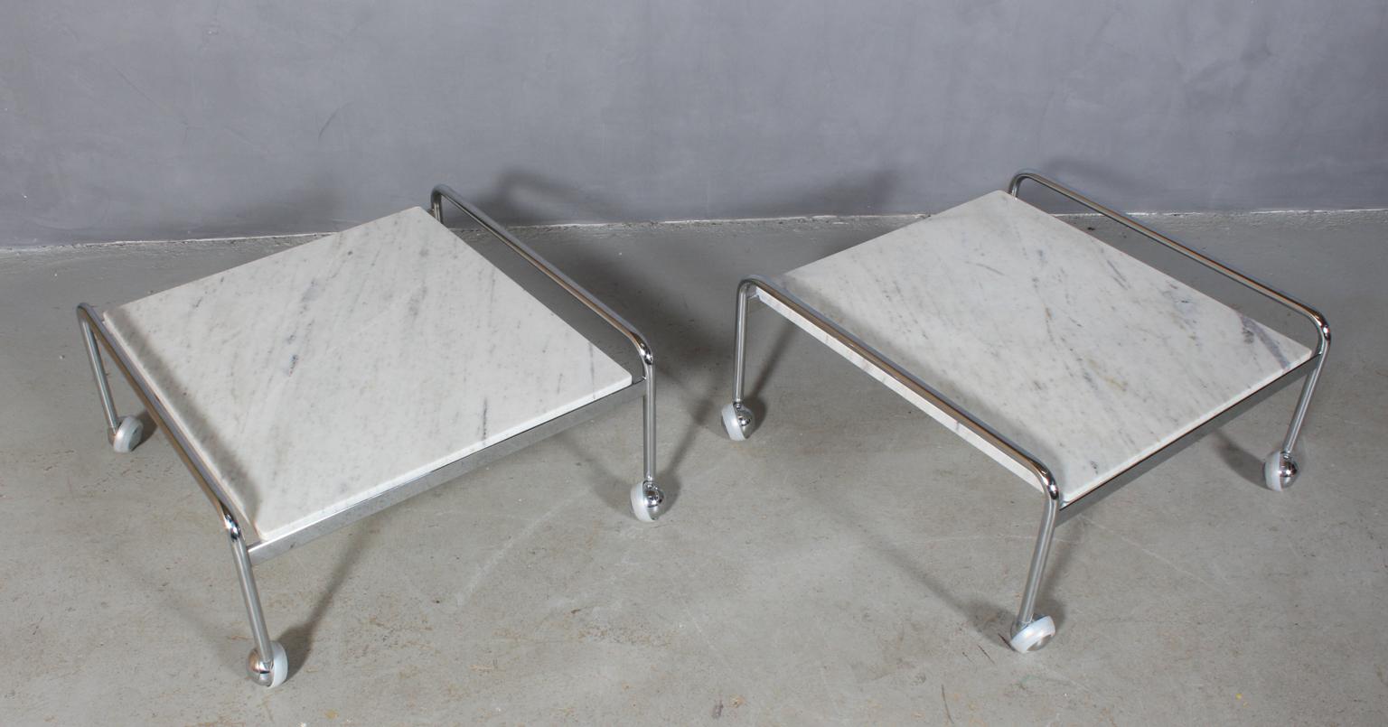 Bruno Mathsson coffee table of polished steel and marble. 

Mounted on wheels.

Model Karin, made by DUX.