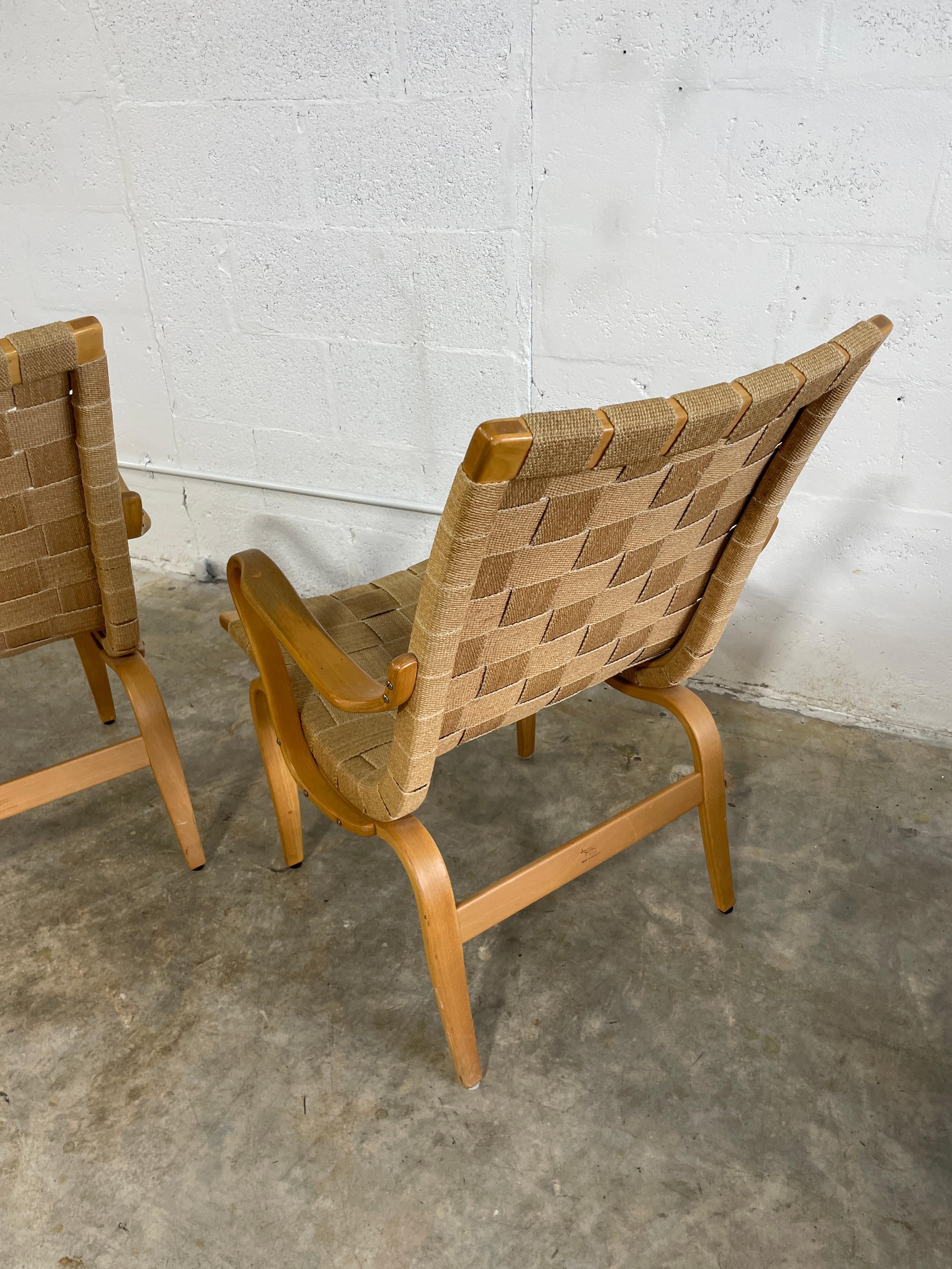 Pair of Bruno Mathsson “Eva” Chairs. Original canvas straps. Labeled. Made in Sweden.
