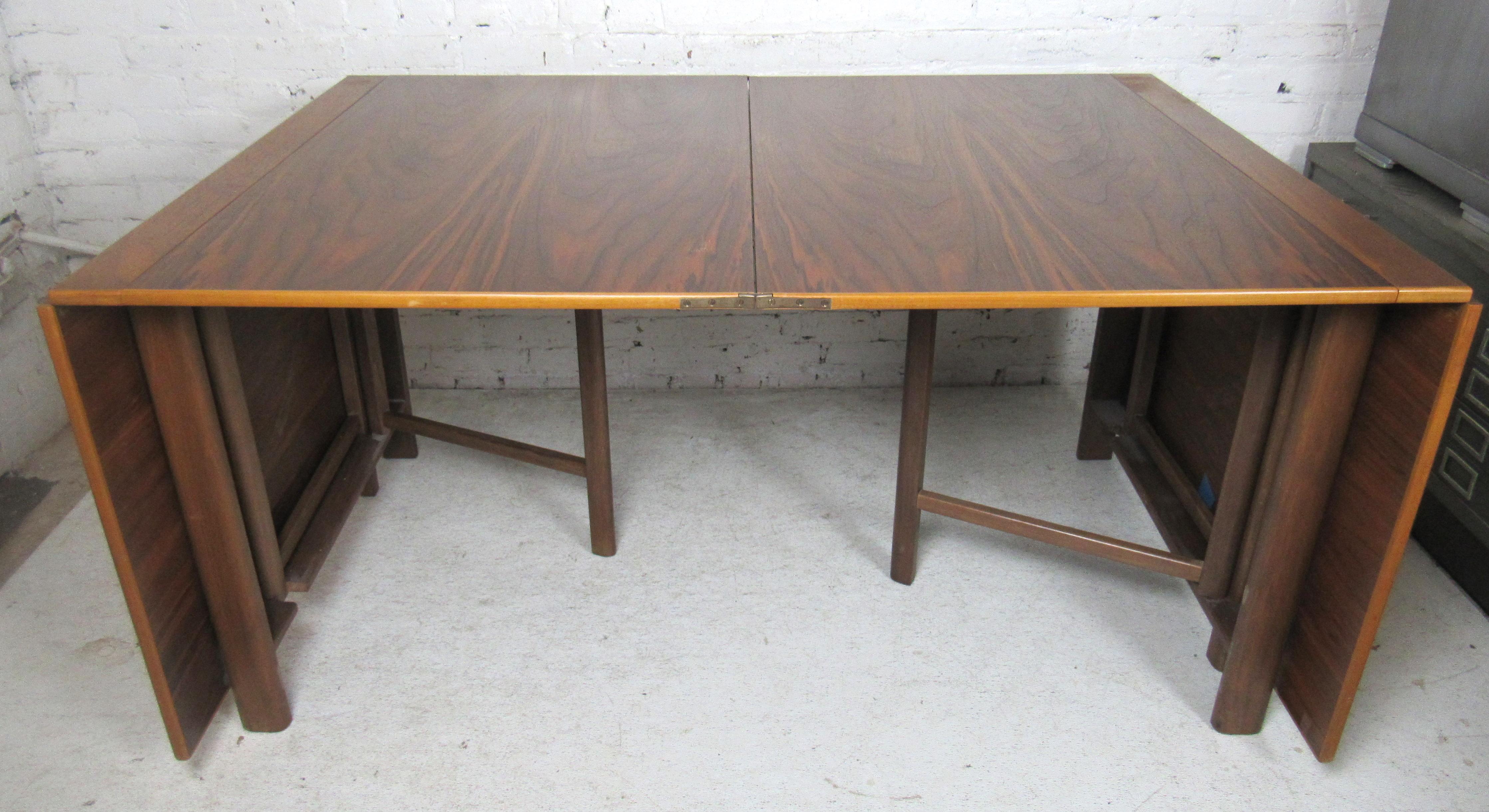 Danish modern drop elaf table that opens up to 109