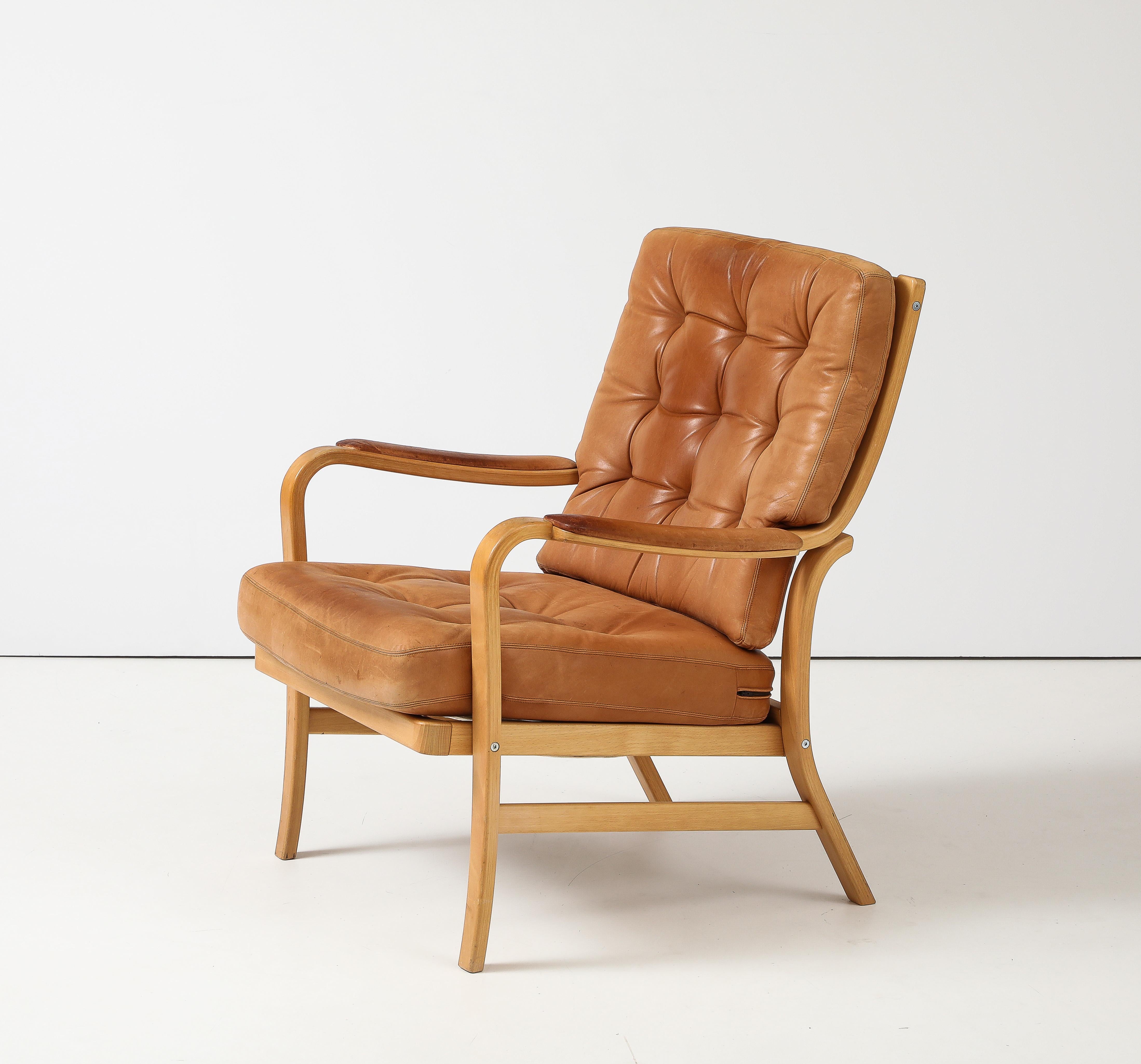 Chief Designer Kenneth Bergenblad, 1978; went into production in 1983.
Leather Chair, Dux, Sweden

Beech, Leather

Chair:   	H: 34.5 W: 29.5 in.  Seat: 17.75 in.

Also available:

Ottoman:	H: 15.75 W: 26.75. D: 25.5 in.
