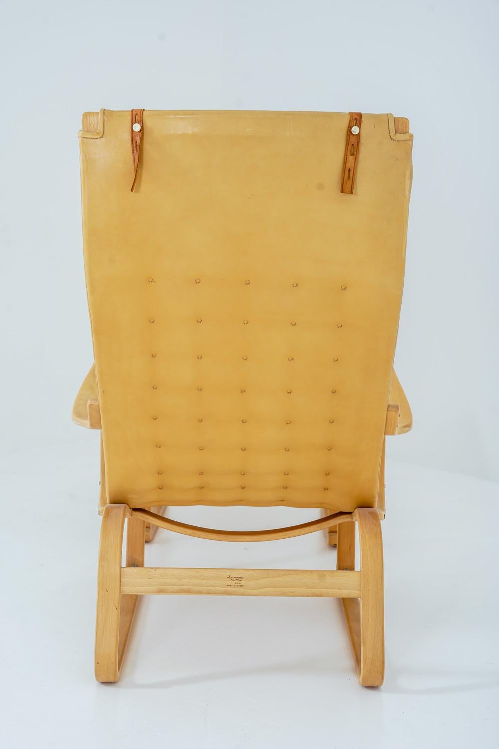 Silla de salón Bruno Mathsson con otomana Modelo 