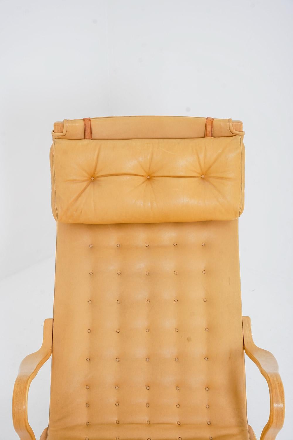 Silla de salón Bruno Mathsson con otomana Modelo 