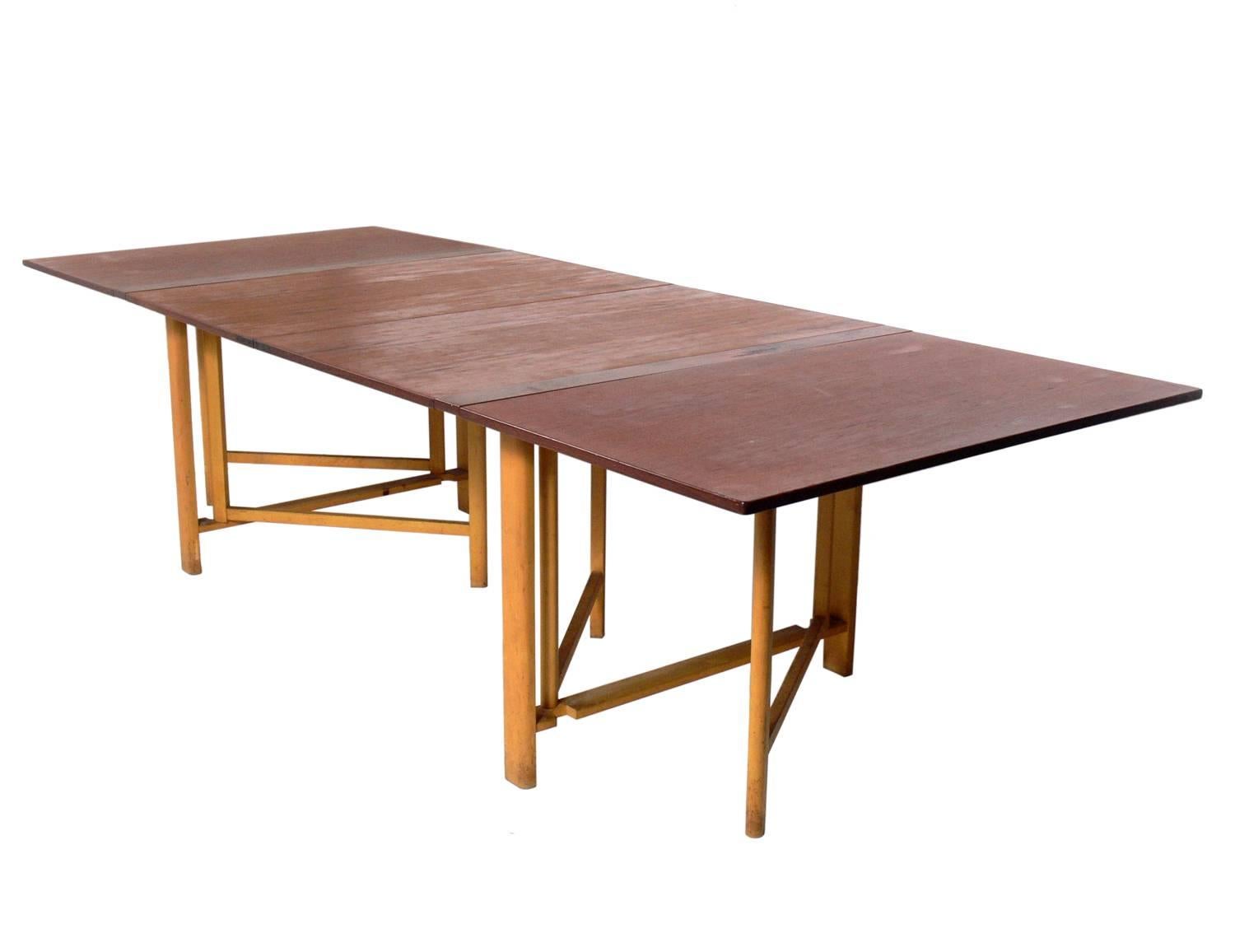 Ingenious Folding Dining Table, designed by Bruno Mathsson, probably made by Firma Karl Mathsson, Sweden, unsigned, circa 1950s. This table is currently being refinished. The price noted below includes refinishing. The table features four 26-inch
