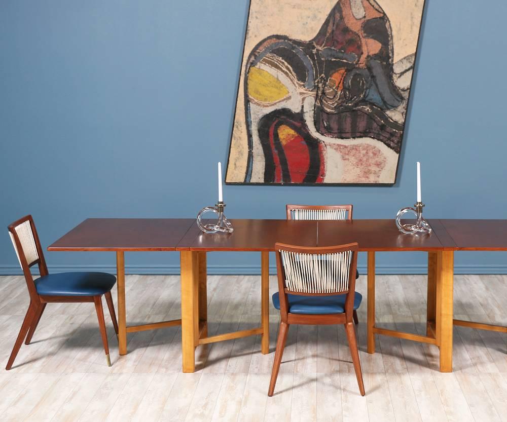 Stunning “Maria Flap” dining table designed by Bruno Mathsson for Karl Mathsson in Sweden circa 1930's. This iconic Swedish modern design features a walnut-stained beech wood top, a solid birch wood base and brass hardware. The versatility of this