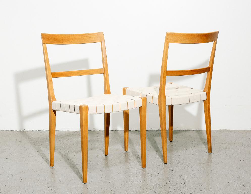 'Mimat' dining chairs designed by Bruno Mathsson for Mathsson International, Sweden. Wonderfully minimalist form with subtle tapering. Beech frame with new off-white canvas webbing. Sold individually.

Measure: 17.75