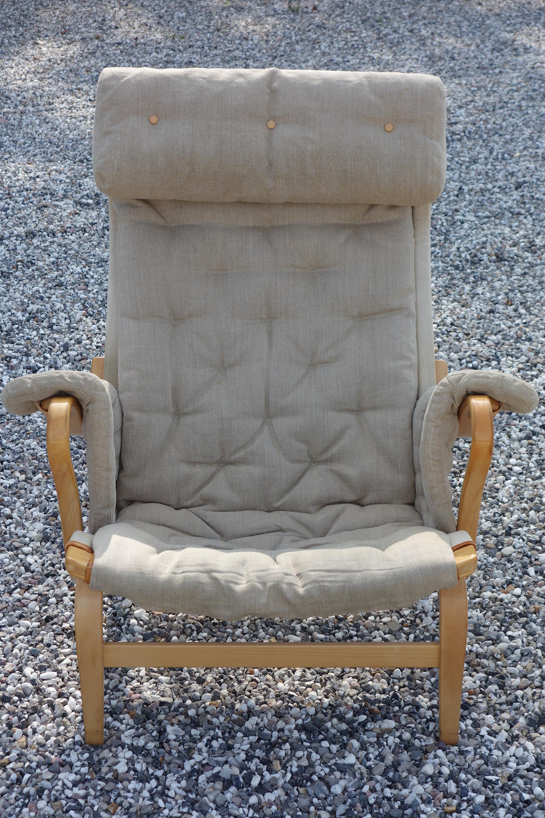 Bruno Mathsson. Pernilla armchair with molded varnished beech frame, seat back stretched with canvas, seat and armrests upholstered in original canvas. Designed in 1944. Made by DUX.