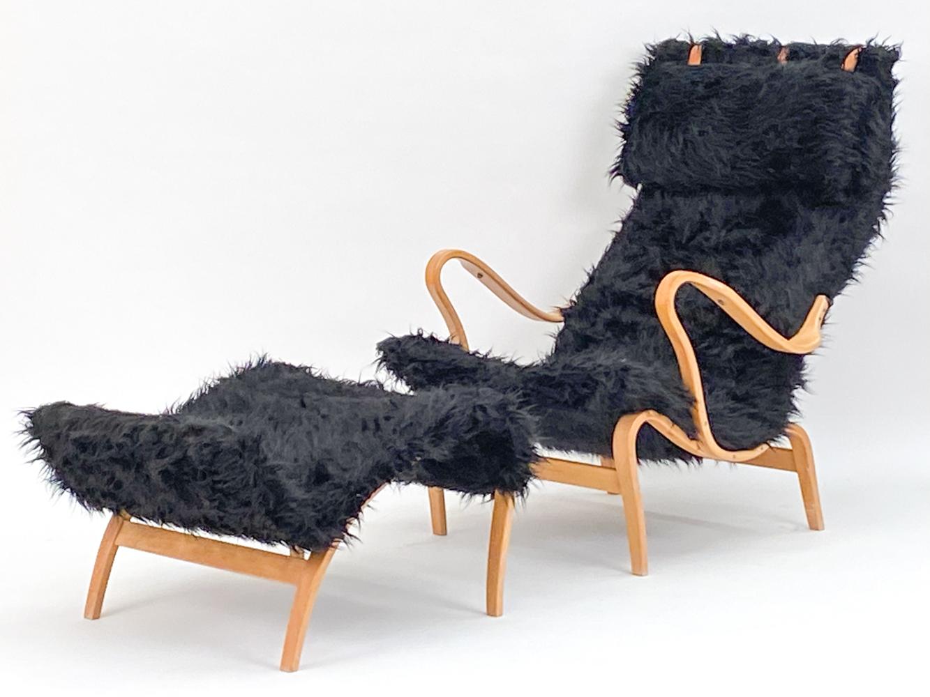 This is an iconic lounge chair designed by Bruno Mathsson, for Dux of Sweden. Known as the 'Pernilla' Lounge chair, this design is most notable for its elegant bentwood frame, with dramatic curves throughout from the feet, to the arms, and the seat
