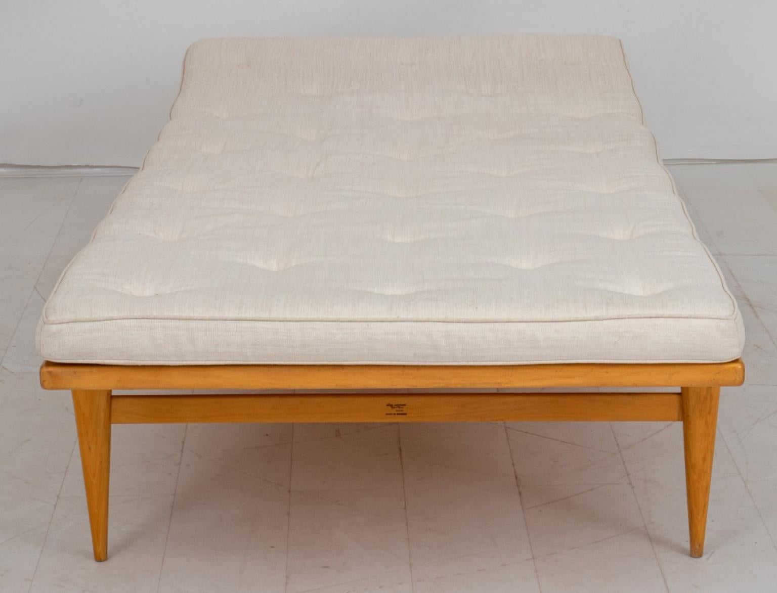 Bruno Mattheson (Swedish, 1907-1988) a ‘T-303’ ‘Berlin daybed’ in beech wood, 1950s, rectangular with one elevated end on four tapering columnar legs, with upholstered mattress intact and covered in natural linen weave.
Provenance: Property From a