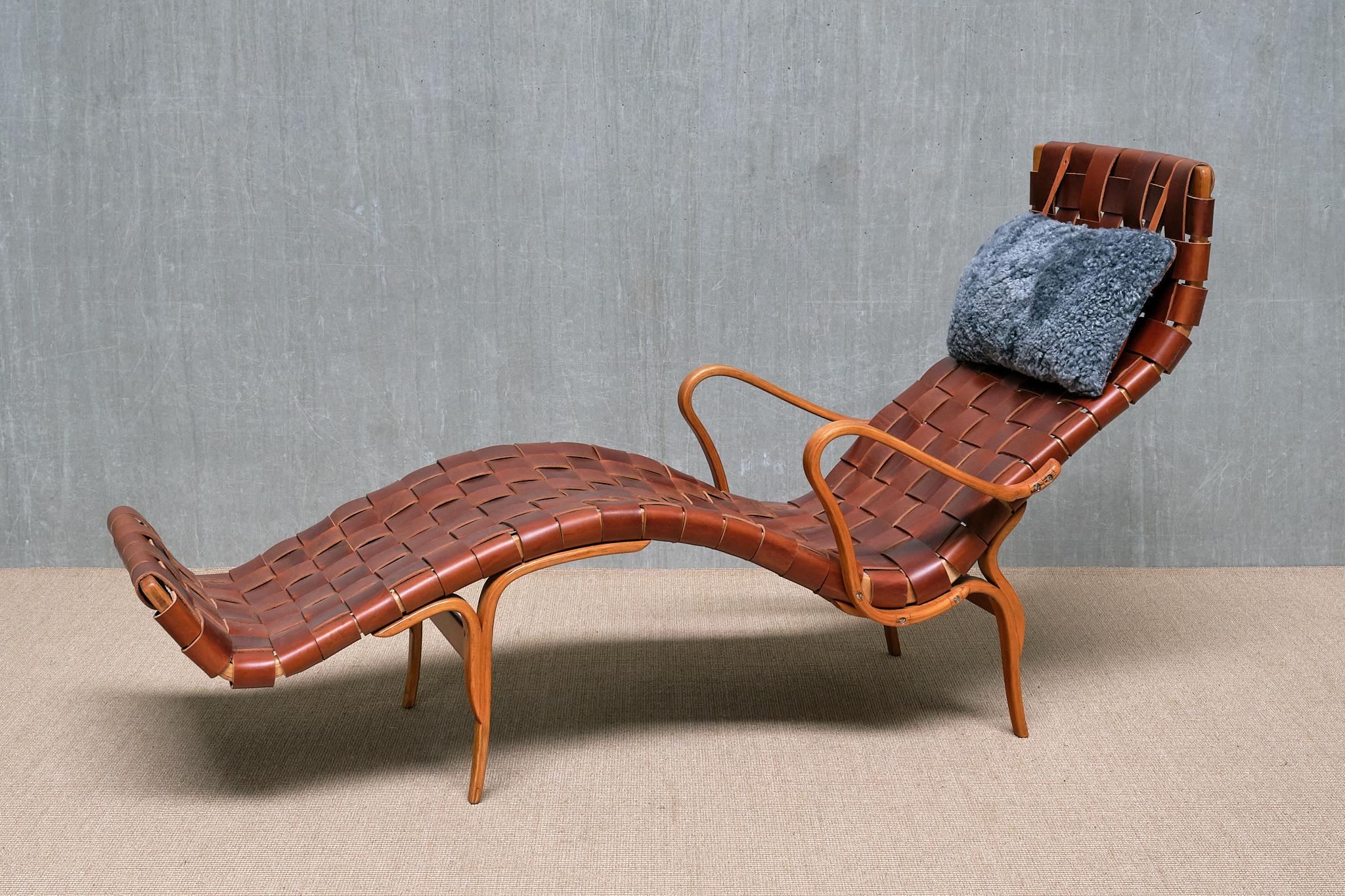 This iconic chaise longue, Pernilla 3, was designed by the renowned Swedish designer Bruno Mathsson. This particular chair is one of the earliest and most original versions, produced by Firma Karl Mathsson in 1944. It retains its original label,