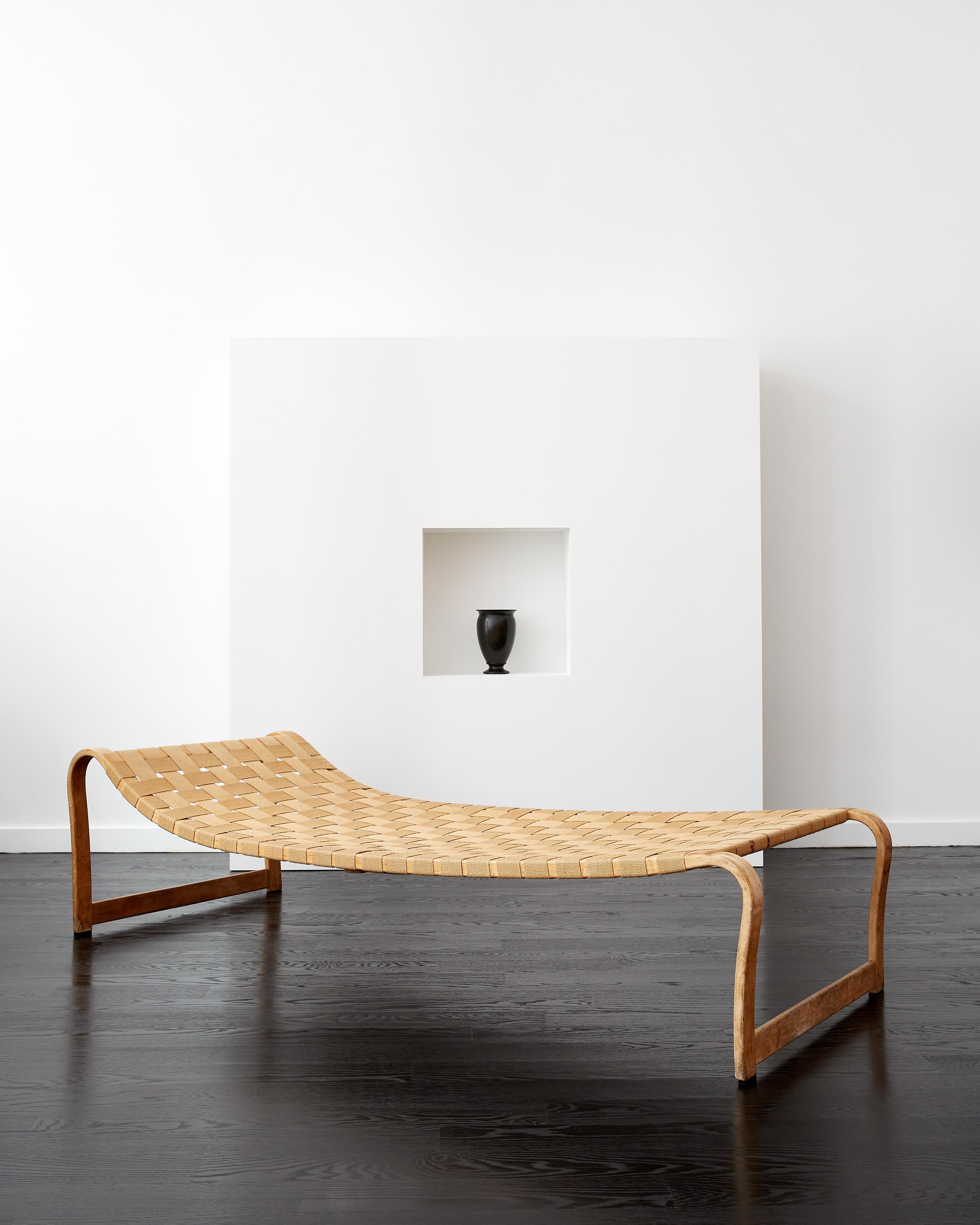 Bruno Mathsson 'Paris' chaise lounge.

Designed in 1936 for the 1937 edition of the Paris International Exposition.

Manufactured by Firma Karl Mathsson, Sweden c. 1937.

Birch, hemp webbing.

The bent wood frame is all original, untouched