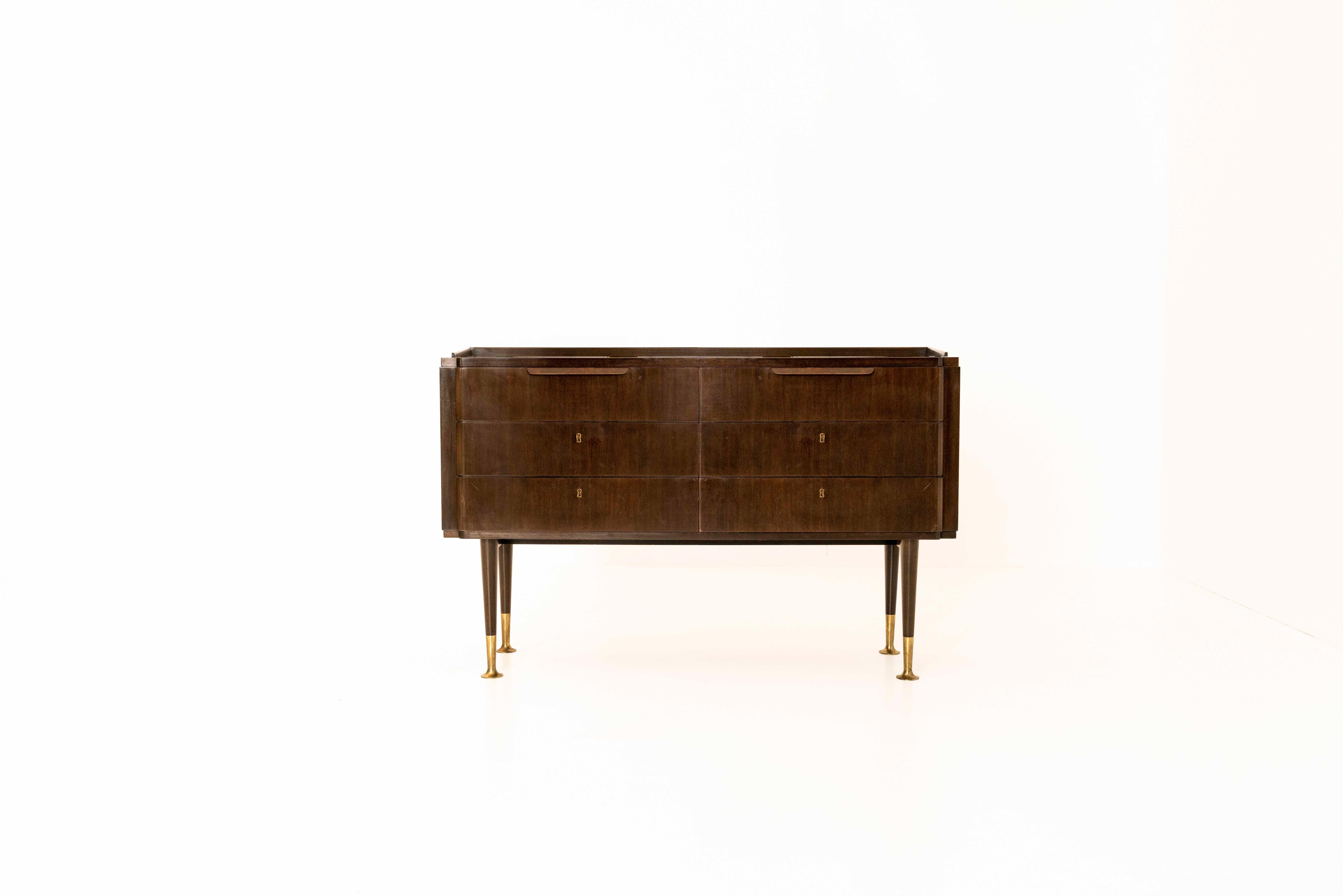 Nico chest of drawers or cabinet by Bruno Paul for WK Möbel from Germany, the 1920s. This chest of drawers in rosewood has two drawers with handles and four drawers with keys. The handles are made out of brass as are the feet. It is in good