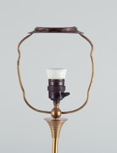 Bruno Paul, German architect. Tall Art Deco table lamp in polished brass