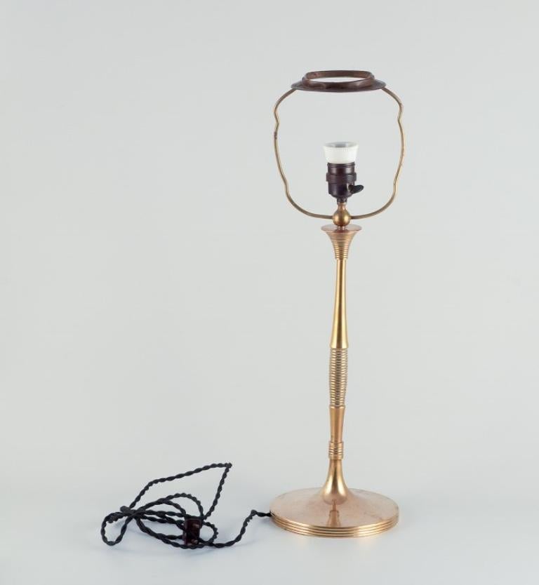 Bruno Paul, German architect. Tall Art Deco table lamp in polished brass For Sale 1