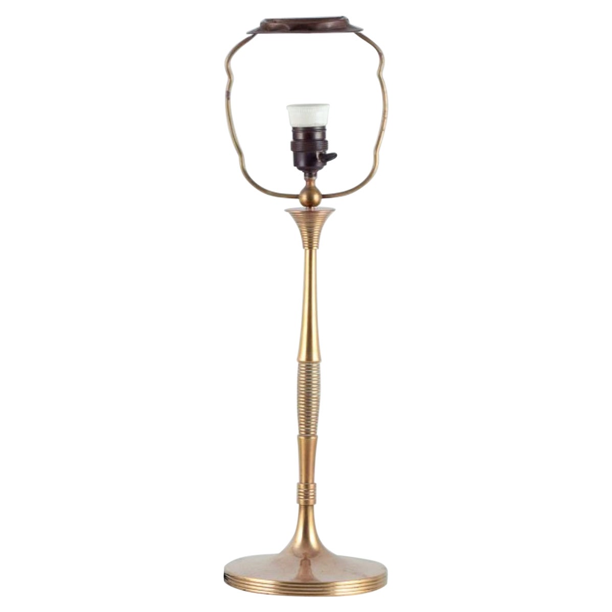 Bruno Paul, German architect. Tall Art Deco table lamp in polished brass
