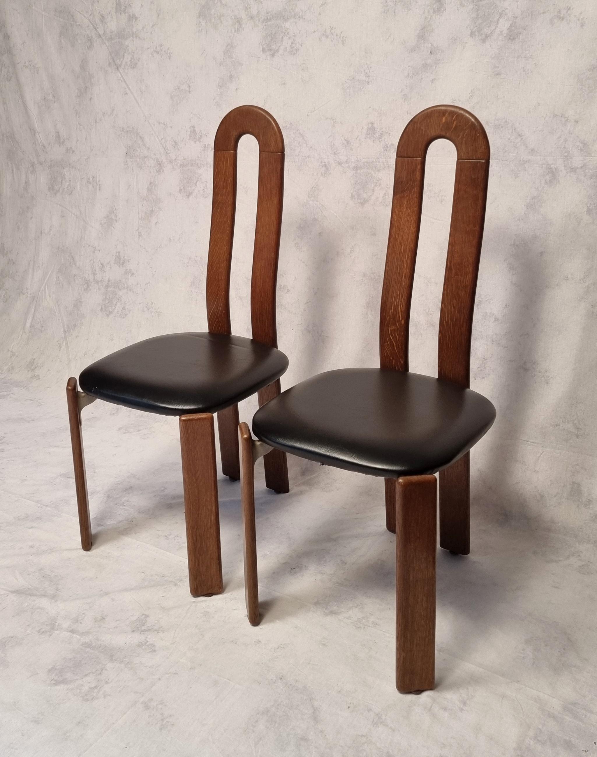 Superb and rare pair of chairs by well-known Swiss designer Bruno Rey. This pair is edited by its historical editor Dietiker and is manufactured by the Swiss workshop Stuhl aus Stein am Rhein. These high back chairs are made of solid oak. The seat