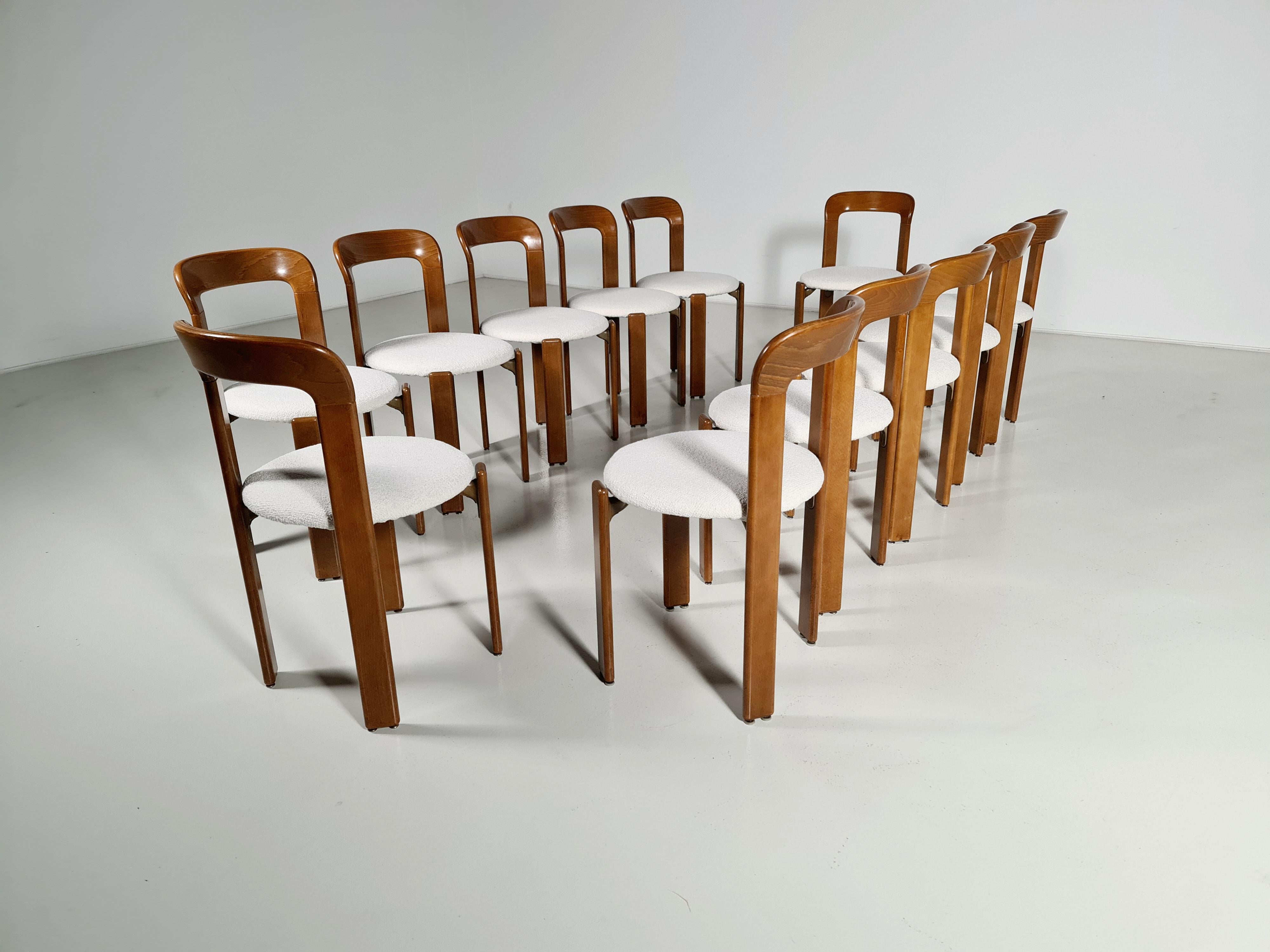 Set of 12 Bruno Rey vintage dining chairs, Switzerland, 1970. Made of beechwood and reupholstered in a boucle fabric.

Referred to as 