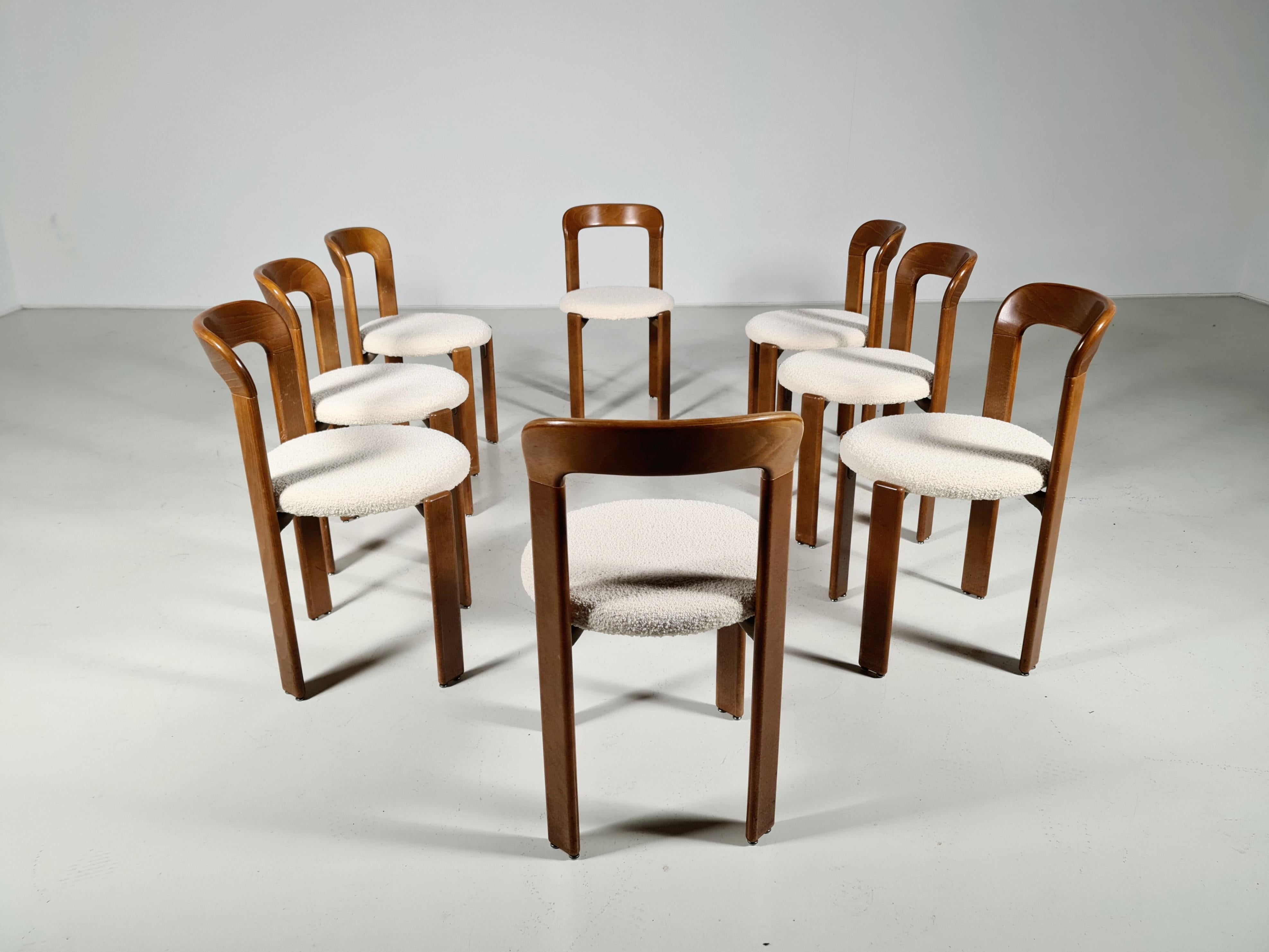 Set of 8 Bruno Rey vintage dining chairs, Switzerland, 1970. Made of beechwood and reupholstered in a boucle fabric.

Referred to as 