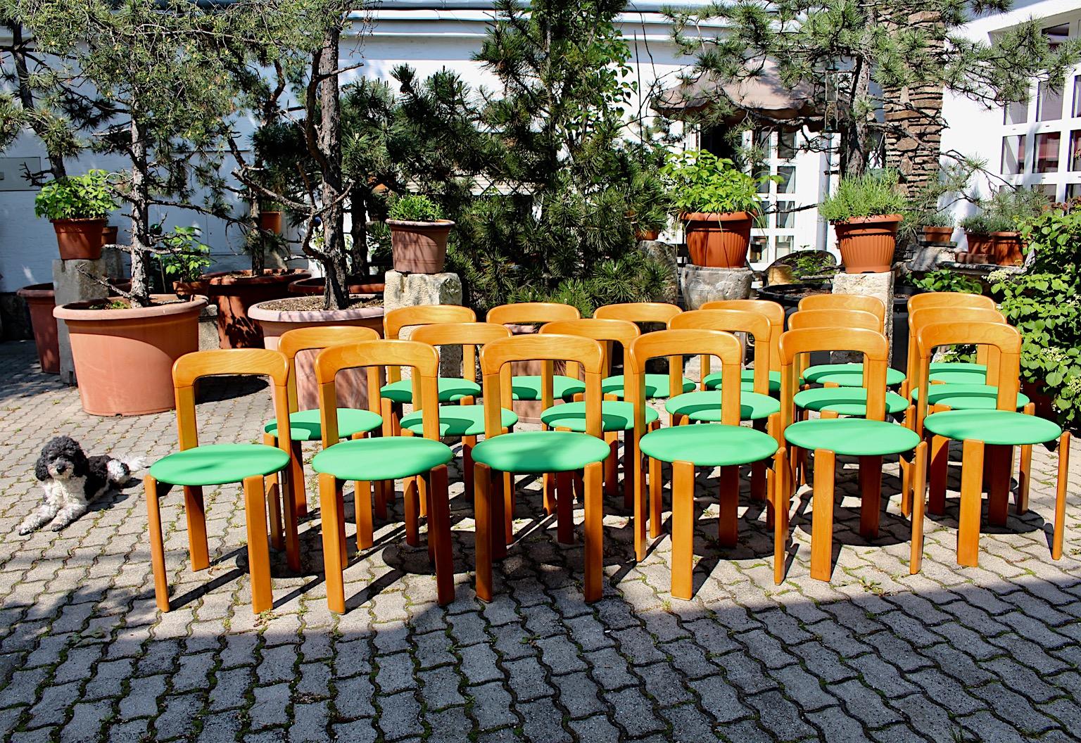 Bruno Rey vintage dining chairs from honey brown beech and upholstery covered with green textile fabric.
The wonderful 25 pieces of vintage dining chairs were designed by Bruno Rey 1970s Switzerland.
The stackable dining chairs were made of solid