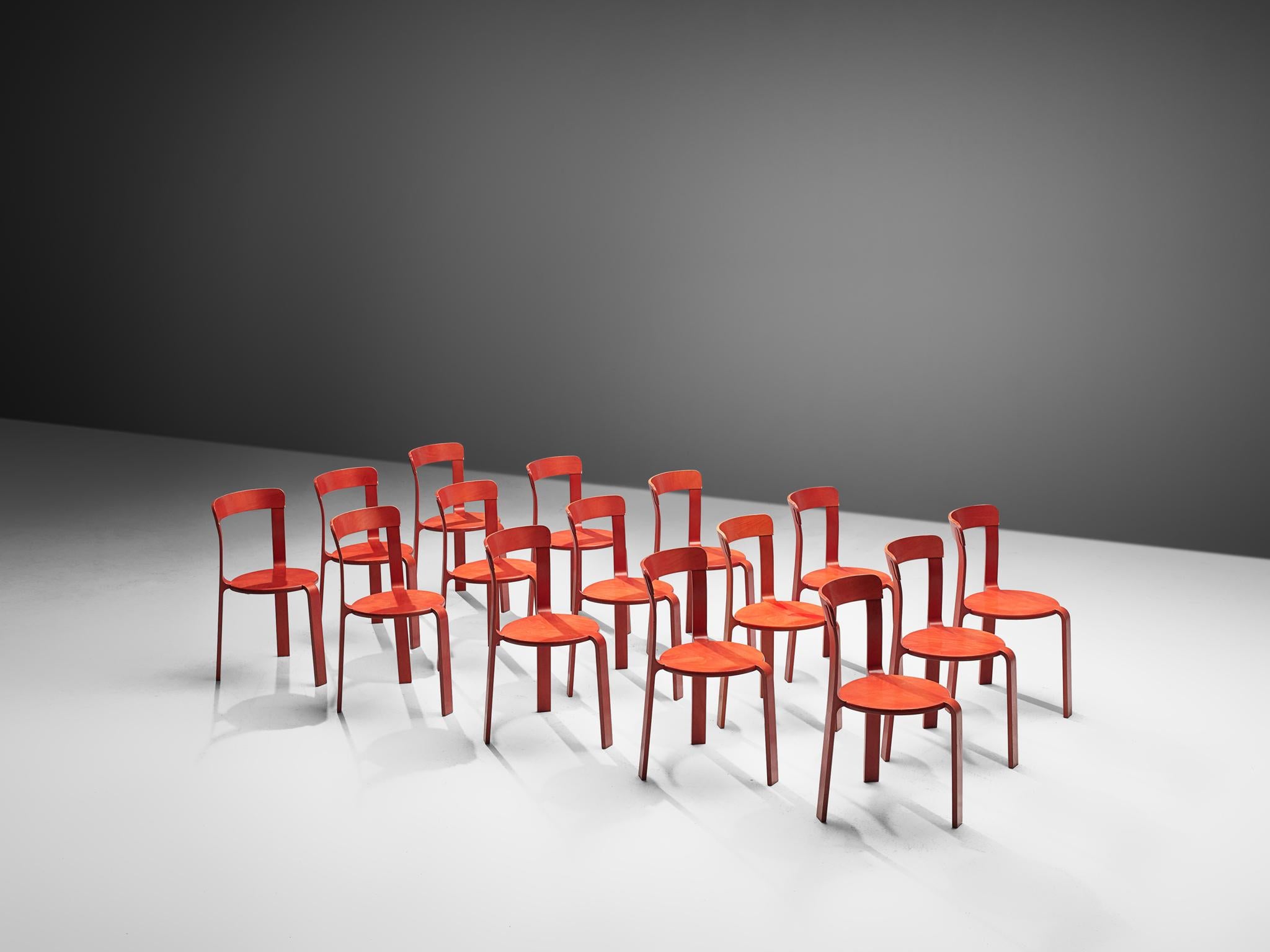Bruno Rey for Dietiker, chairs, plywood, Switzerland, 1970s 

This large number of chairs is made in beech plywood. The stool shows a basic design, with three bent legs that smoothly flow into the surface of the round seat. The hind legs run up
