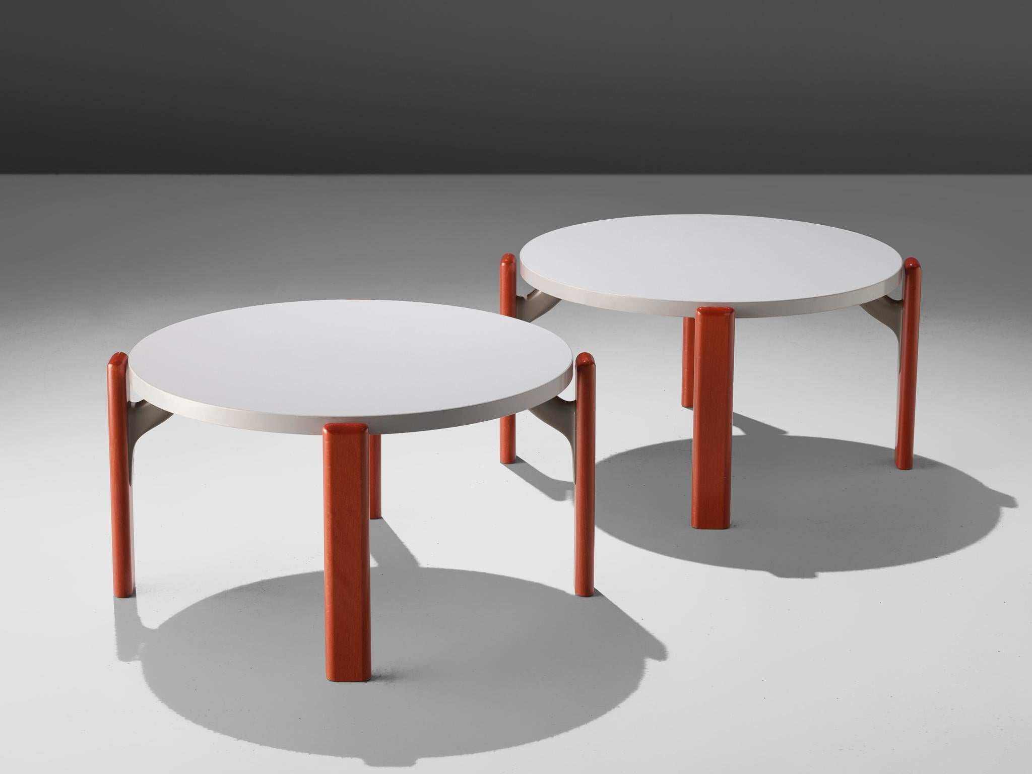 Bruno Rey for Dietiker, pair of coffee tables, plywood, Switzerland, 1970s

These coffee tables feature four red lacquered wooden legs and a round white table top. A grey connection hold the legs and the top together. Special features it the