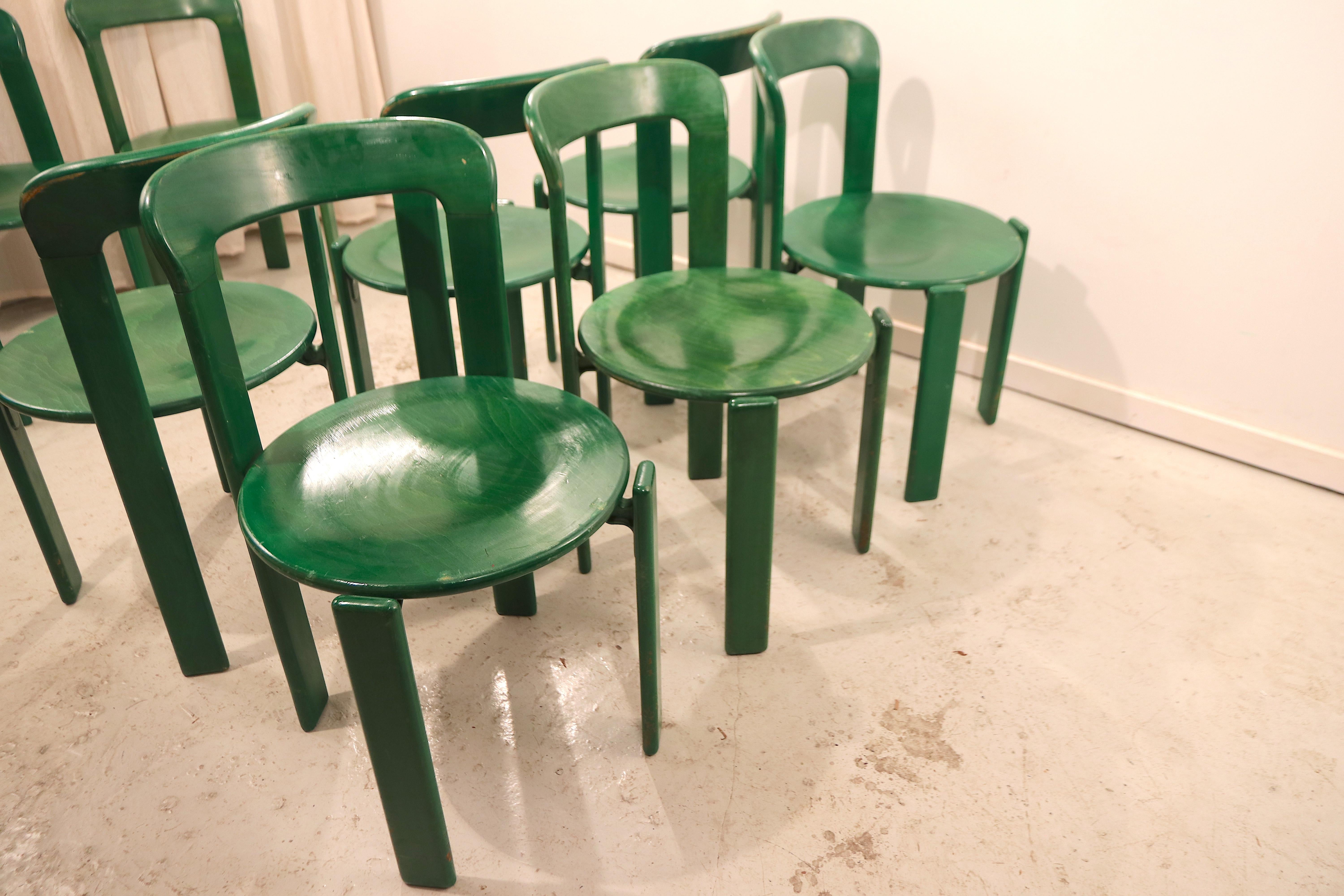Wonderful set of 8 rare green lacquered beechwood Bruno Rey dining chairs manufactured in the 1970s by Dietiker, Switzerland. The design of the chars distinguishes through their screw-less metal on wood mount, for which they got the first patent.