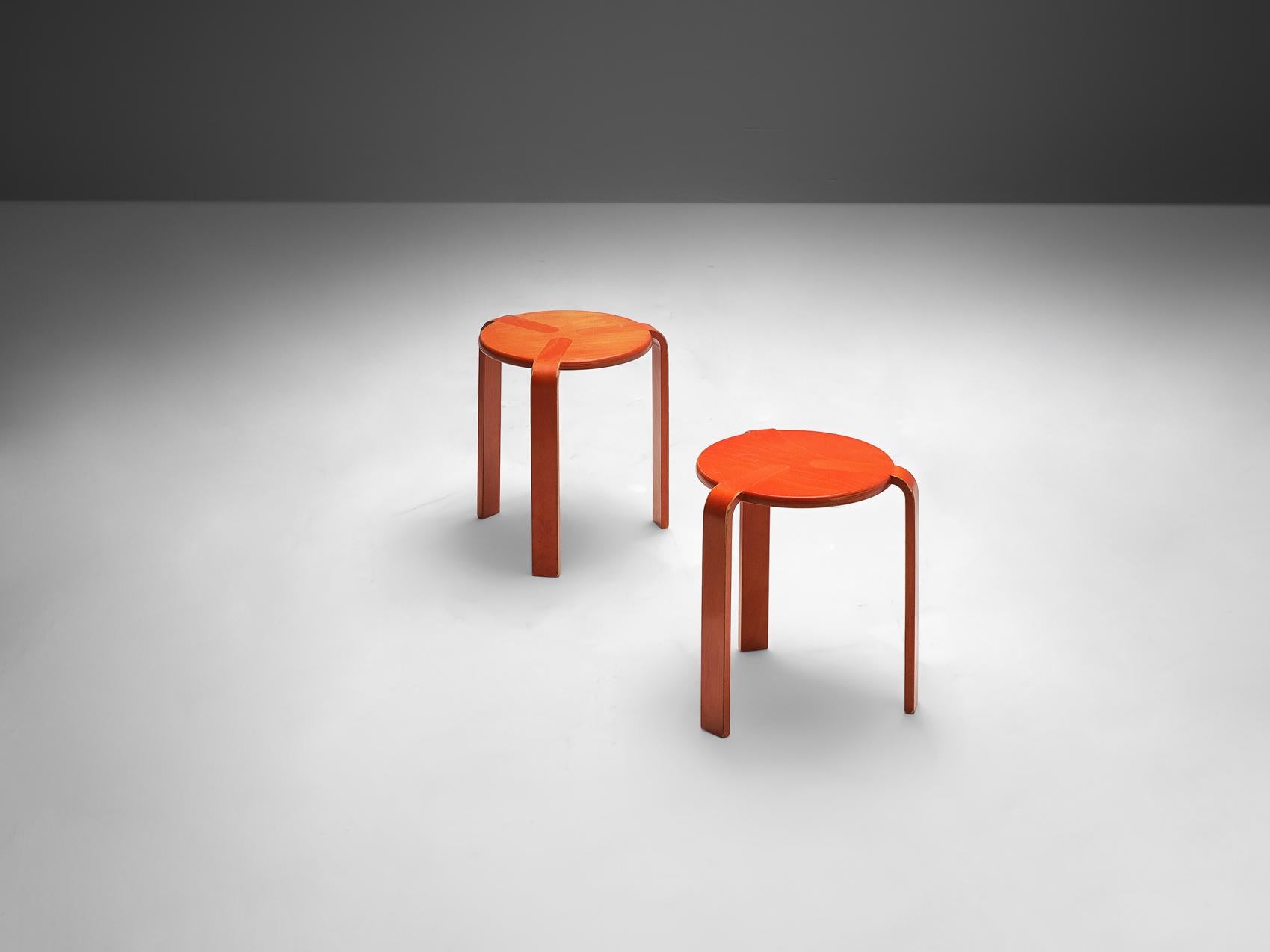Bruno Rey for Dietiker, stools, beech plywood, Switzerland, 1970s 

These stools are made of beech plywood. The stool shows a basic design, with three curved legs that merge smoothly into the surface of the round seat. These stools are stackable