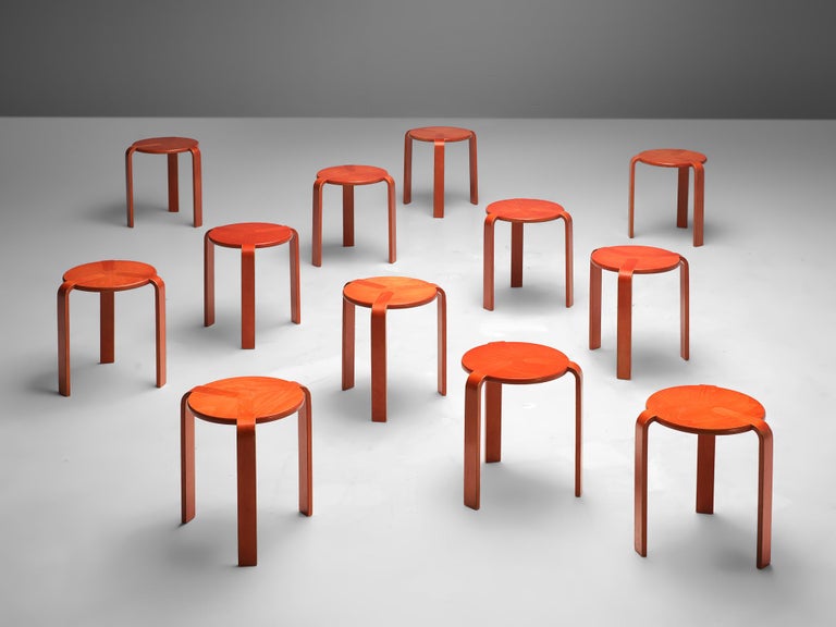 Bruno Rey for Dietiker, twelve barstools, plywood, Switzerland, 1970s 

This large number of stools is made in beech plywood. The stool shows a basic design, with three bent legs that smoothly flow into the surface of the round seat. These stools