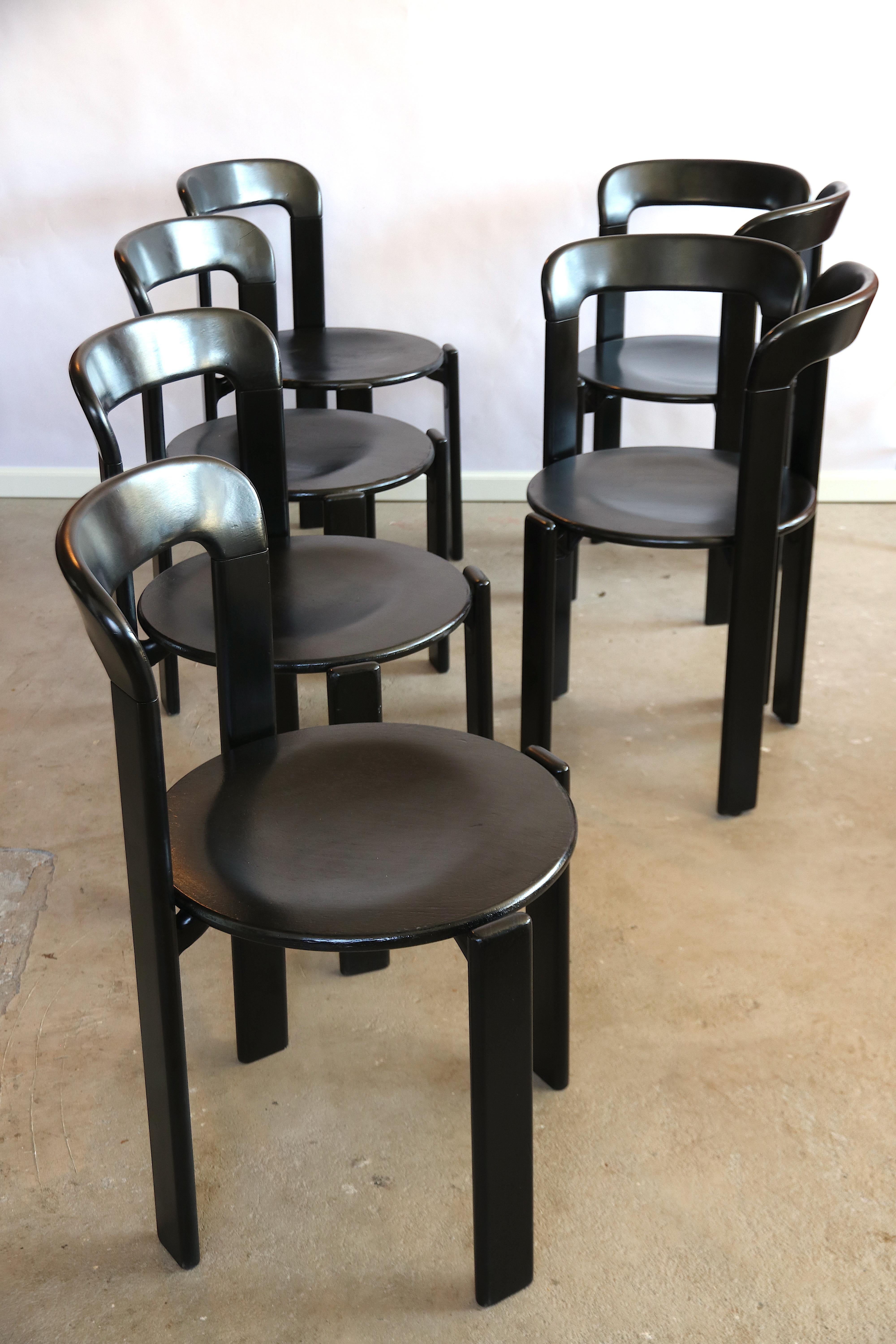 This is a beautiful set of the iconic ebonized black dining chairs by Bruno Rey for Dietiker, Switzerland.
In this set of 6 are 4 'normal' dining chairs and 2 ultra rare specimen of this model with the double backrest (to put at the short sides of a
