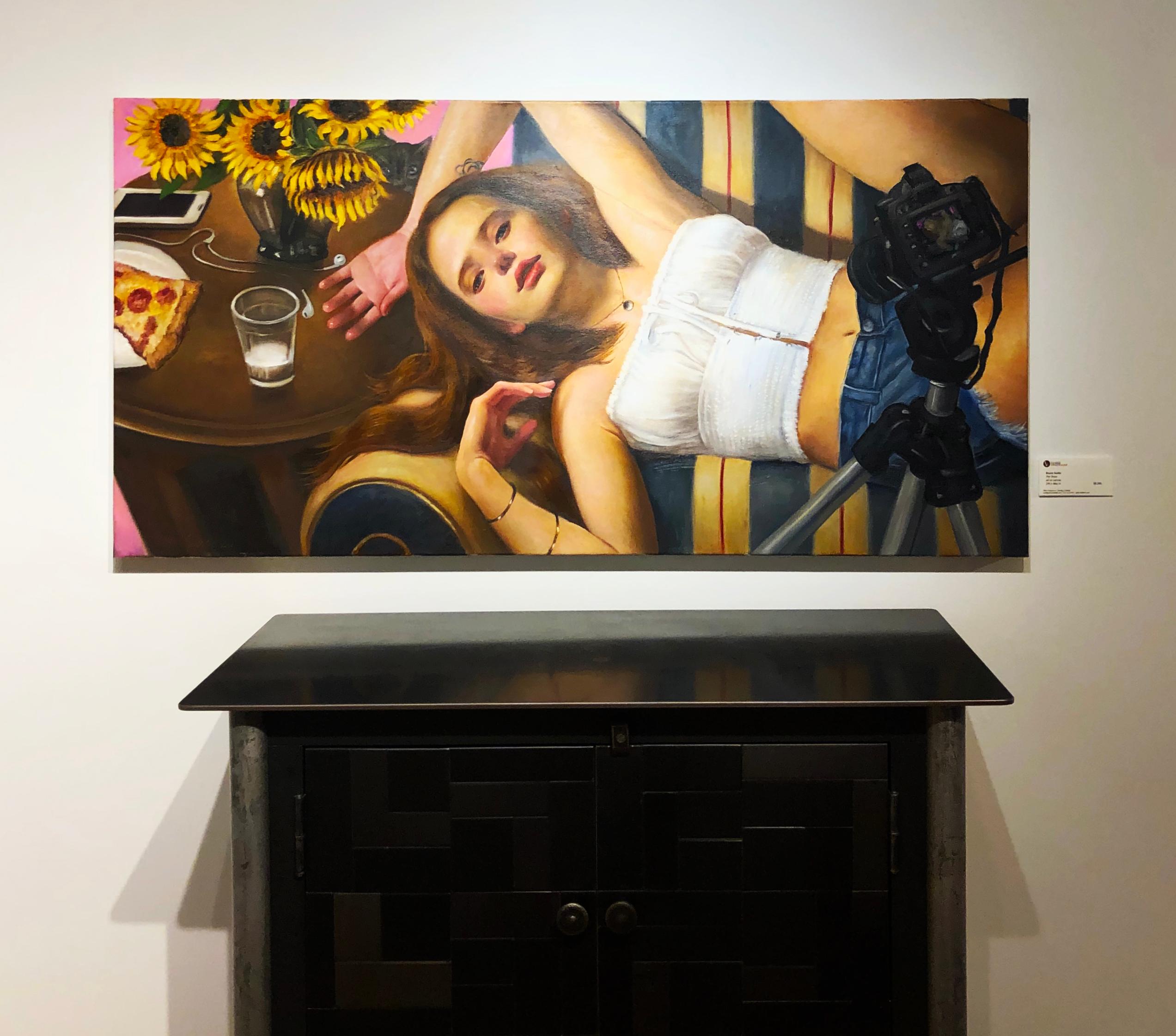 The Show, Young Woman Taking a Selfie, Reclining on Striped Sofa, Oil on Canvas - Brown Interior Painting by Bruno Surdo